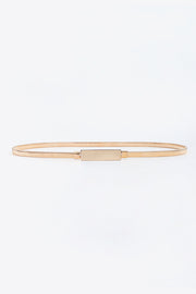 Slim gold-tone elastic iron belt shown laid flat, featuring a sleek narrow silhouette and structured rectangular buckle with clean understated construction.