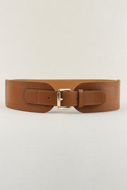 Wide brown PU elastic belt with a structured silver-tone buckle, smooth belt tab, and refined stitched detailing for a polished waist-defining silhouette.