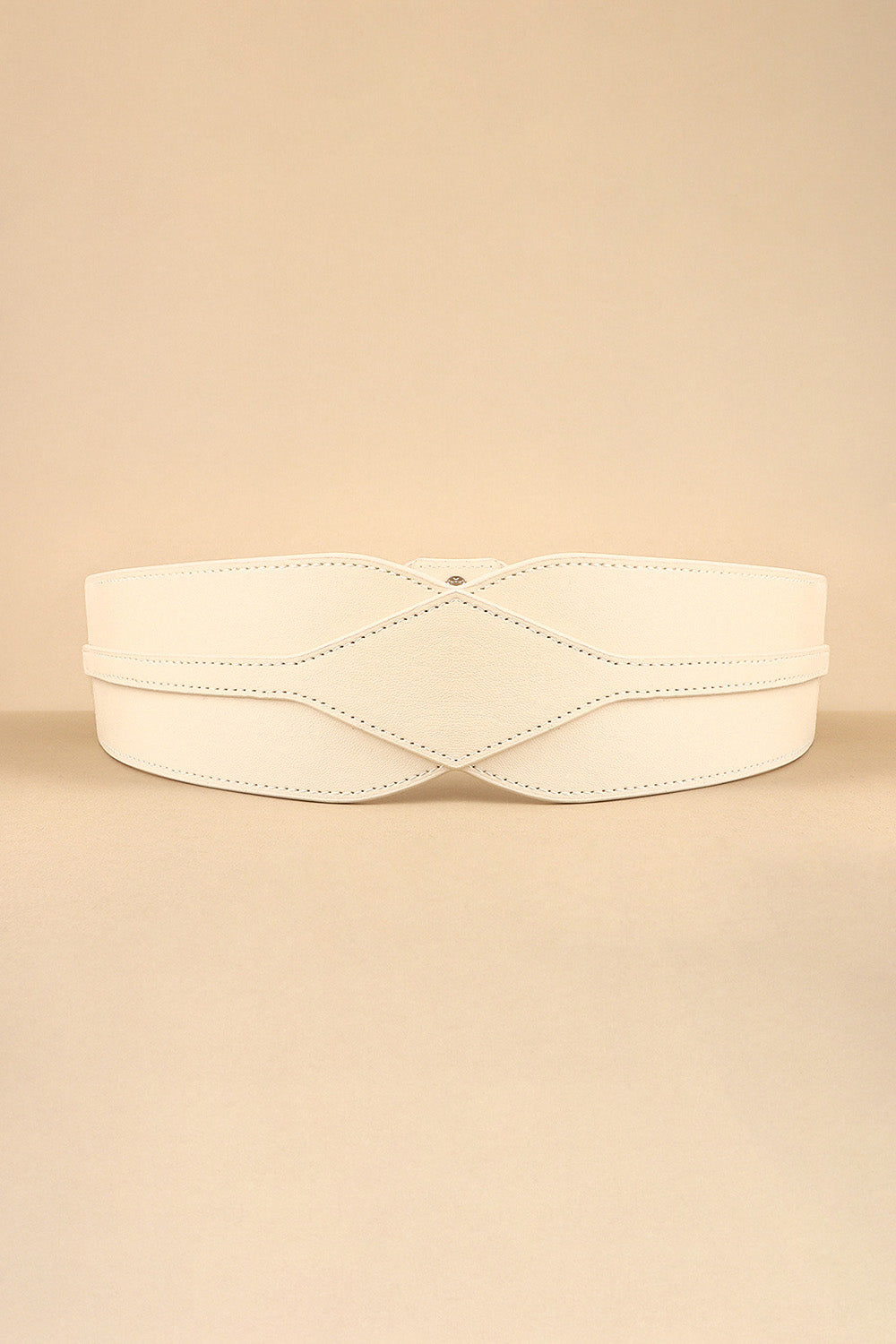 A cream elastic wide PU belt features a bold sculptural silhouette, contoured front, curved bands, and contrast stitching across its broad waist-defining profile.