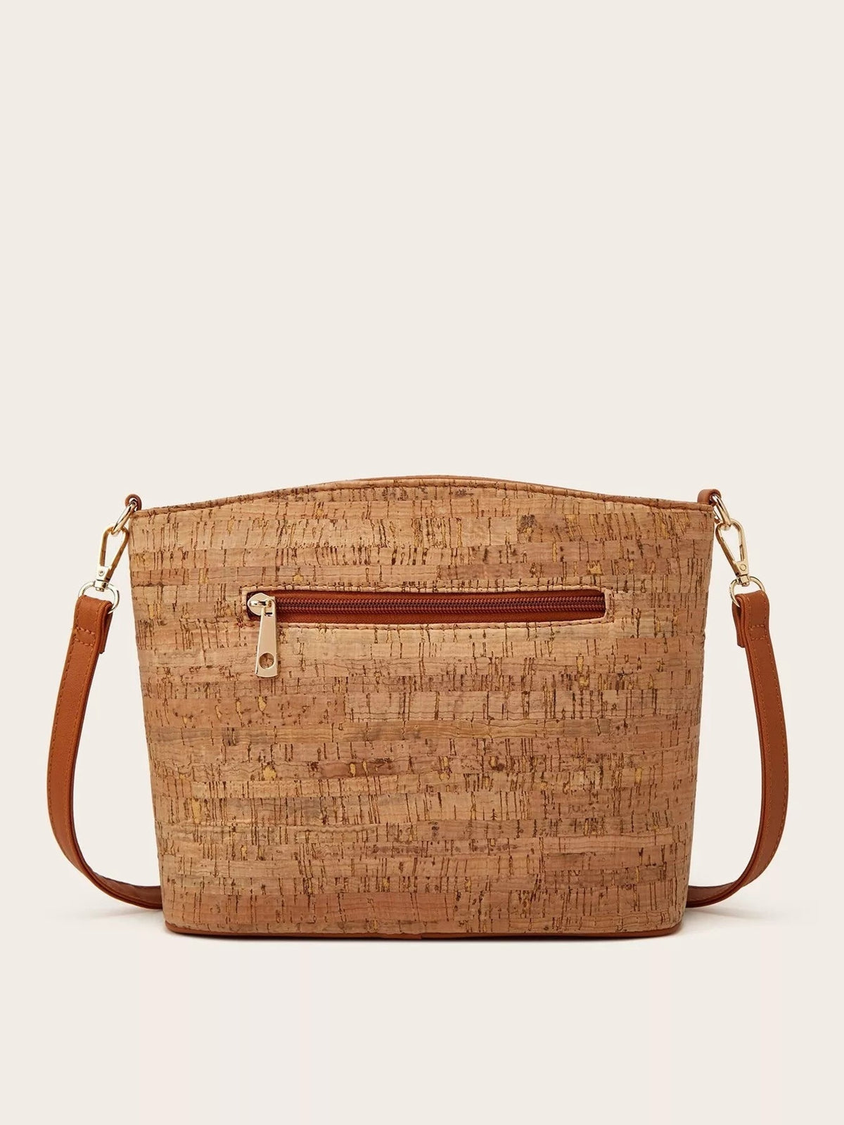 Medium tan PU leather crossbody bag with a tree bark pattern, rectangular silhouette, front zip pocket, brown strap, and metal clasp hardware.