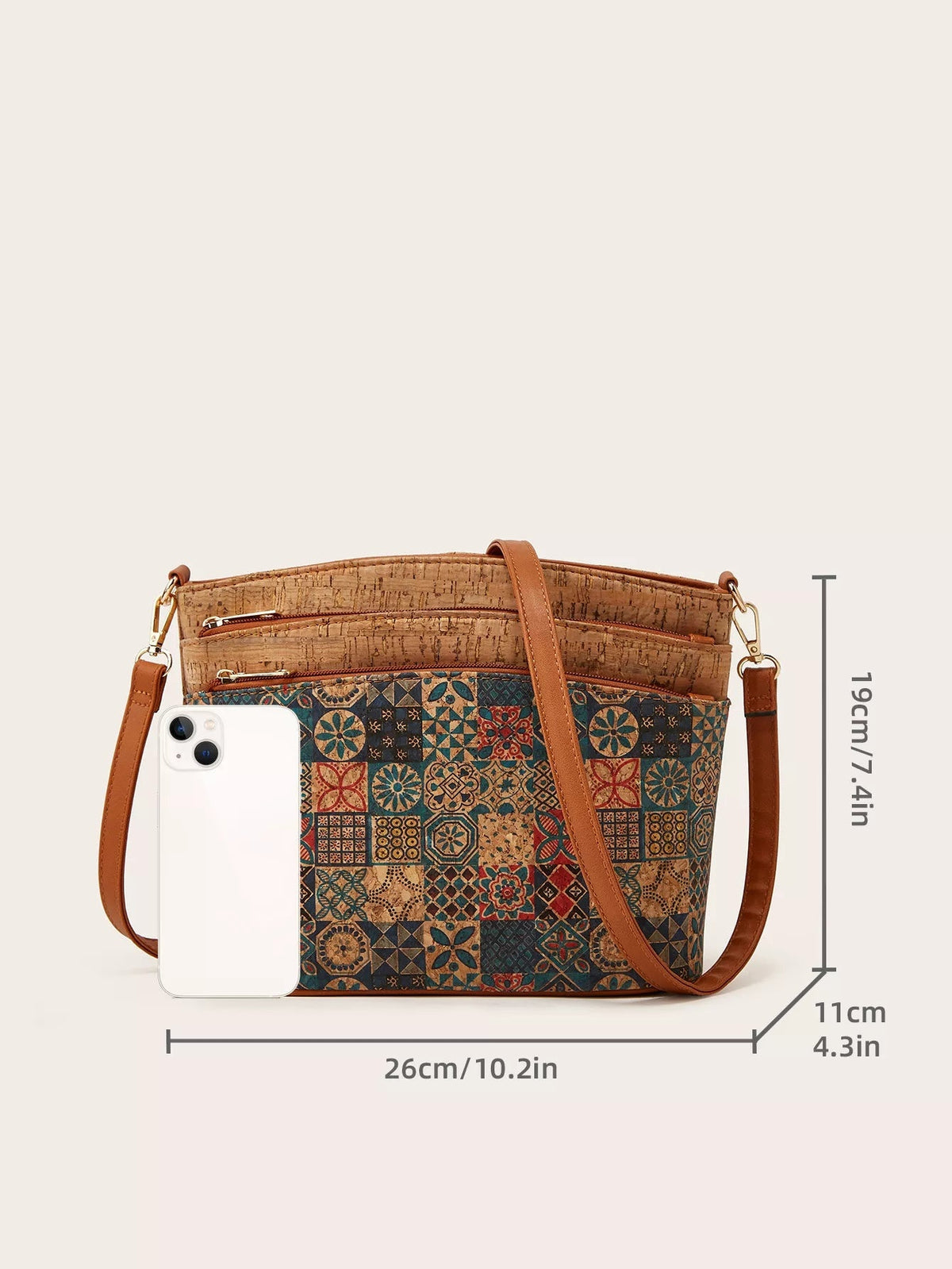 Medium PU leather crossbody bag with a tree bark pattern, colorful ethnic patchwork front, multiple zip pockets, and an adjustable brown strap.