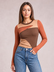 Model in jeans wears a fitted long-sleeve round-neck T-shirt with exposed contrast seams and color-blocked brown, rust, and beige ribbed panels.