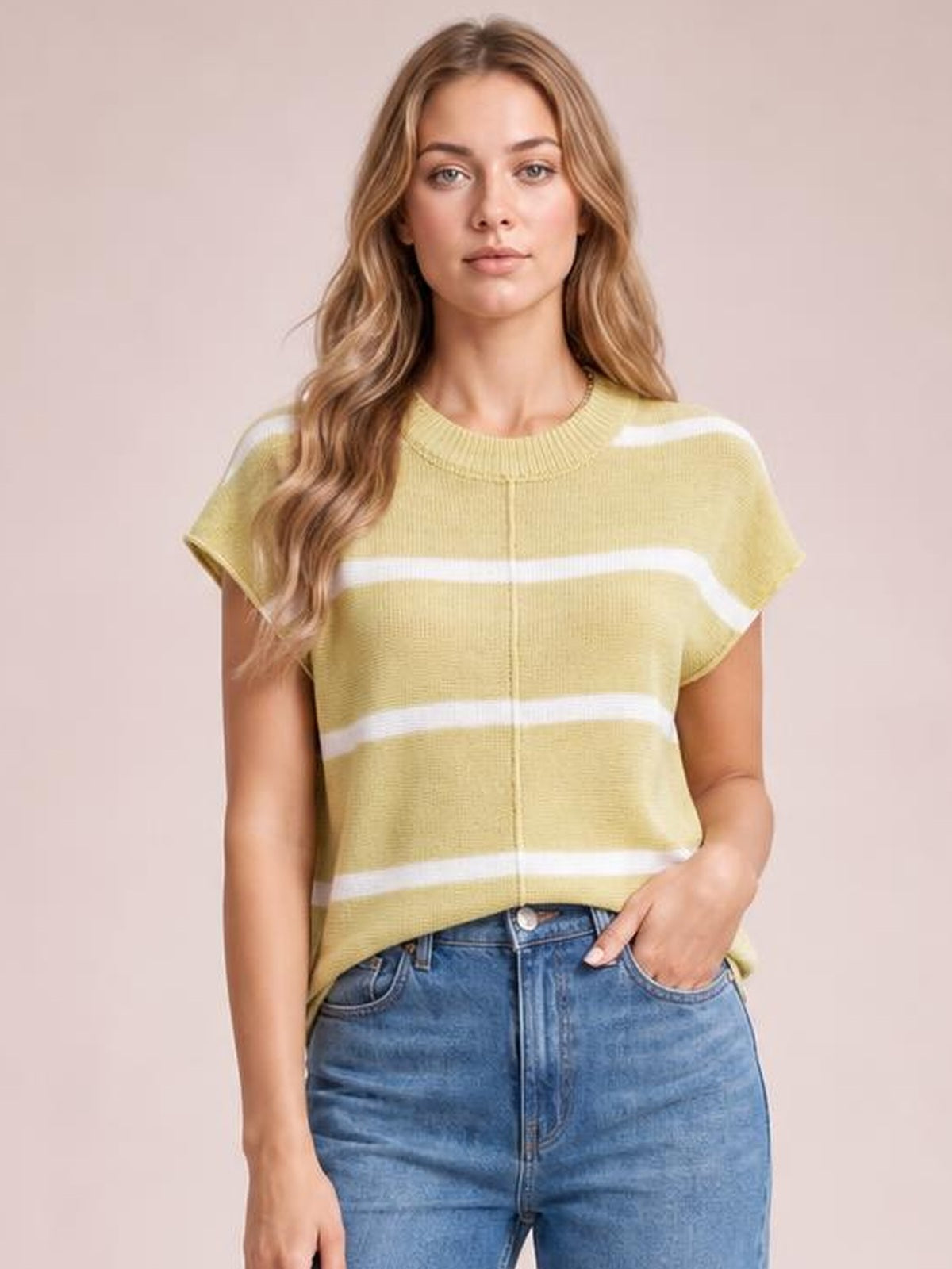 Model wearing a yellow striped round-neck knit top with exposed center seam, short sleeves, and a relaxed straight silhouette.