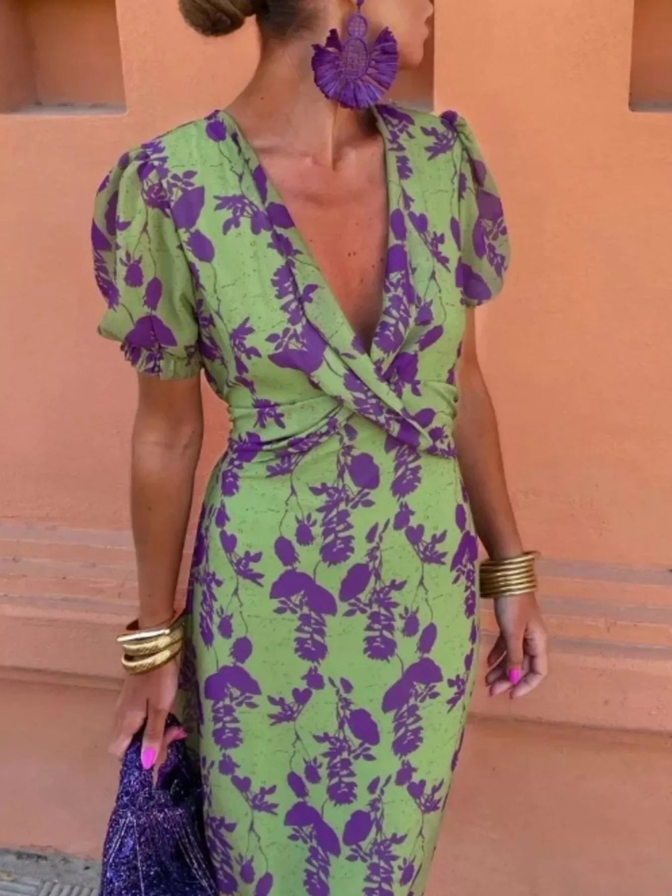 Green floral print midi dress with purple flowers, V-neckline, puff sleeves, and a fitted waist
