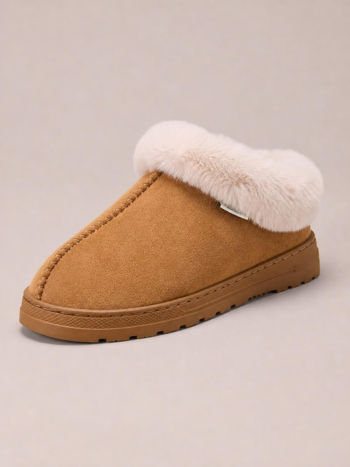 Tan round-toe platform slipper with a plush faux fur collar, suede-like upper, stitched detailing, and a thick rubber lug sole.