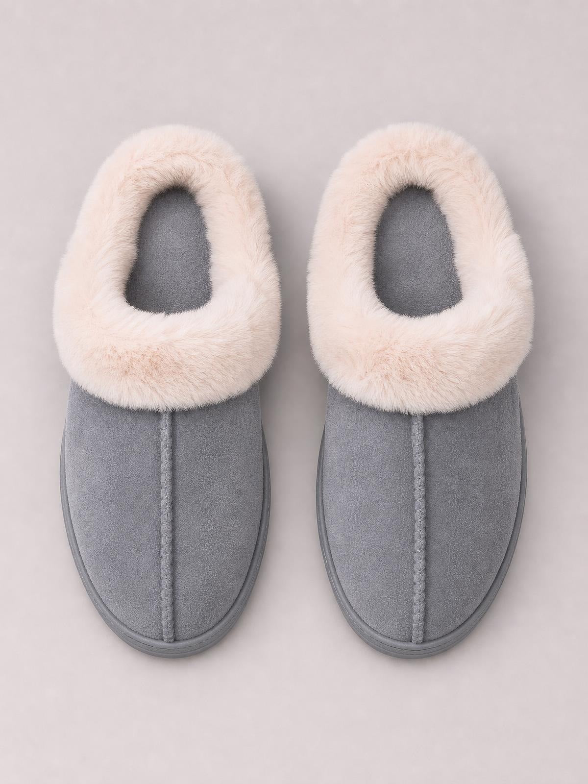 Pair of gray faux fur round toe platform slippers with plush cream collars, soft suede-like uppers, center stitching, and flat rubber soles.