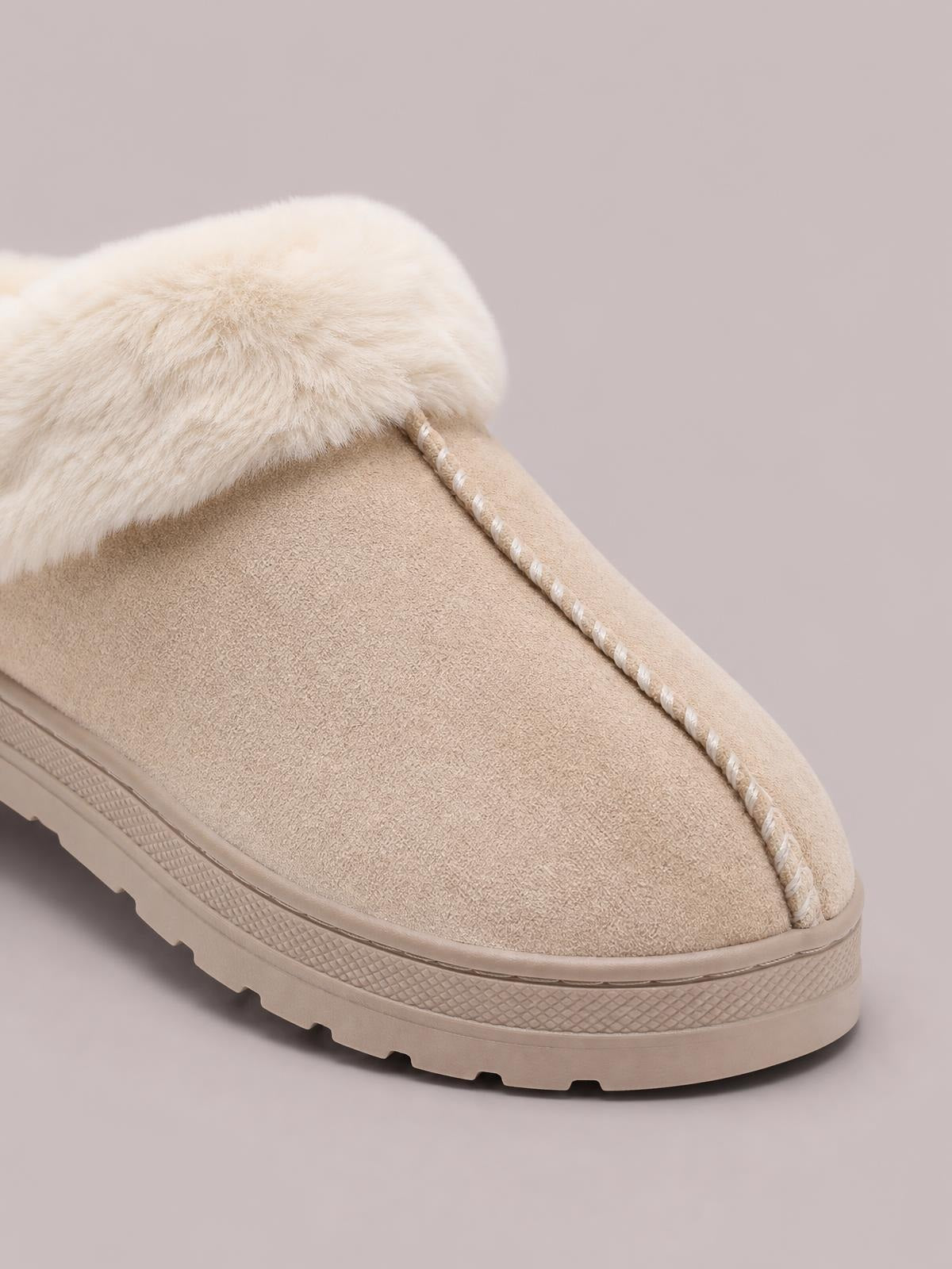 Cream faux fur round toe platform slipper with a soft suede-like upper, stitched trim, and a chunky textured rubber sole.