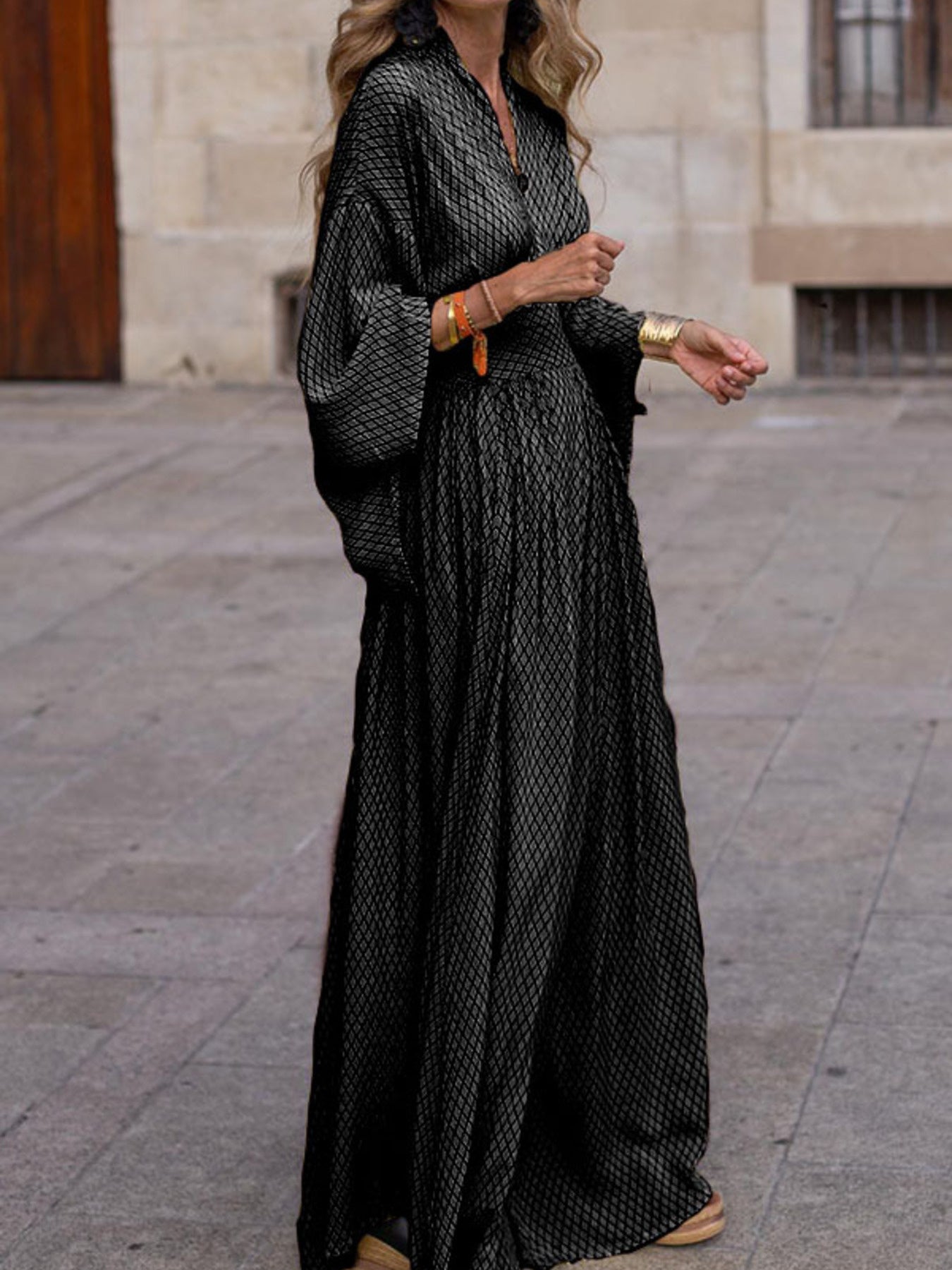 Flowy geometric maxi dress with V-neck and long sleeves in green, black, gray, red, and yellow