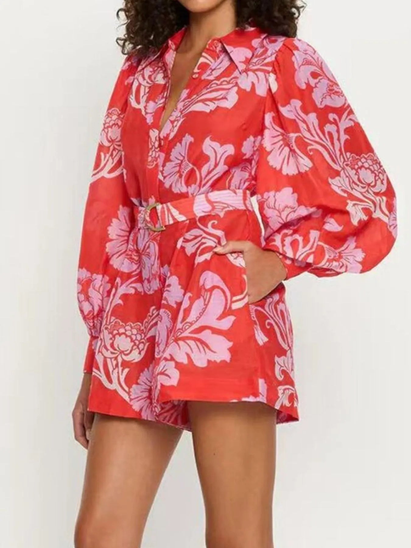 Printed Long Sleeve Belted Romper with Tie and Buttons.
