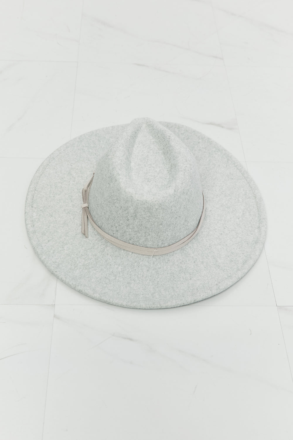 Light gray Festival Babe fedora hat with a defined crown, wide 3.5-inch brim, slim coordinating band, and delicate tie detail.