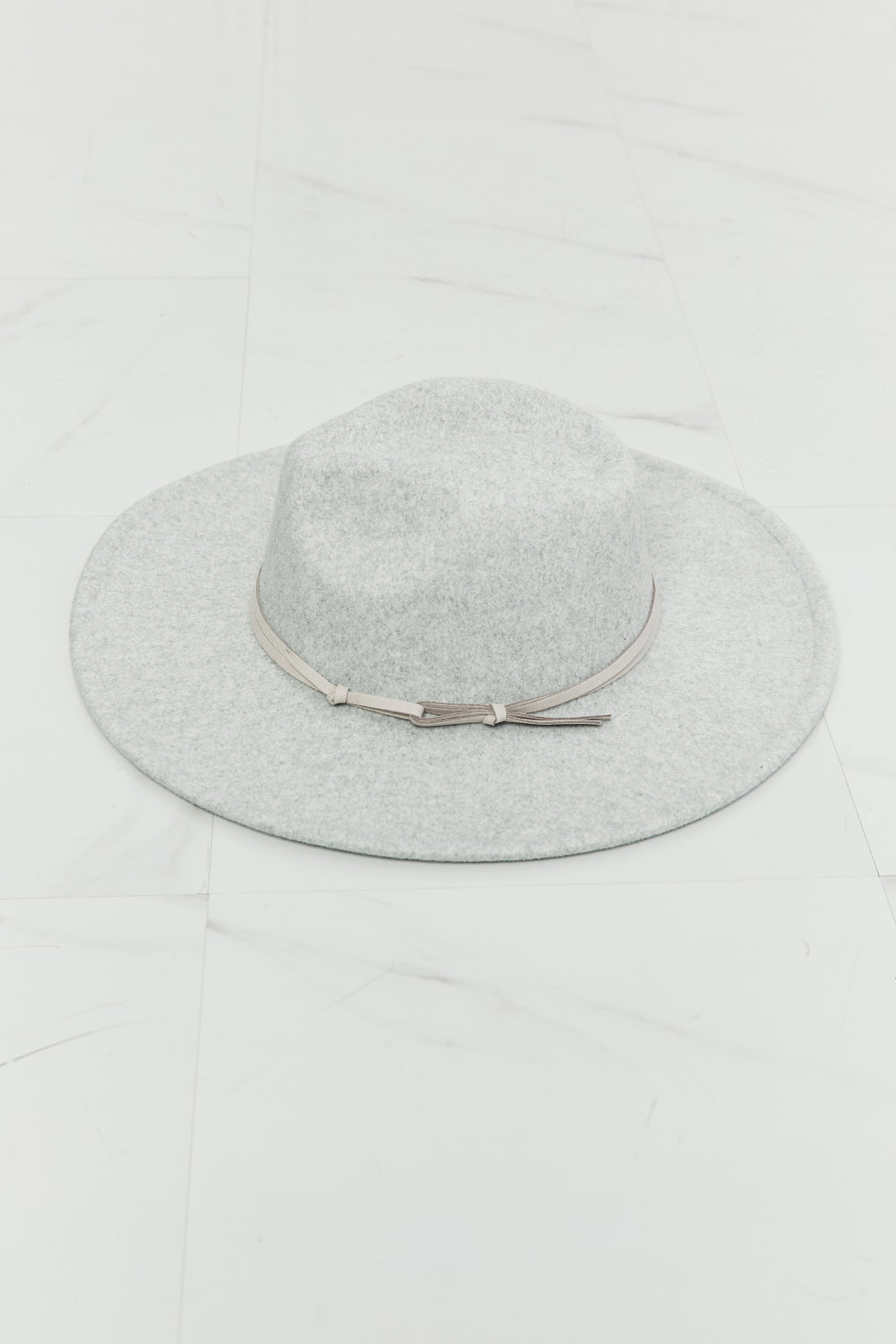 Light gray Festival Babe fedora hat with a structured crown, wide 3.5-inch brim, and slim coordinating band finished with a delicate tie.
