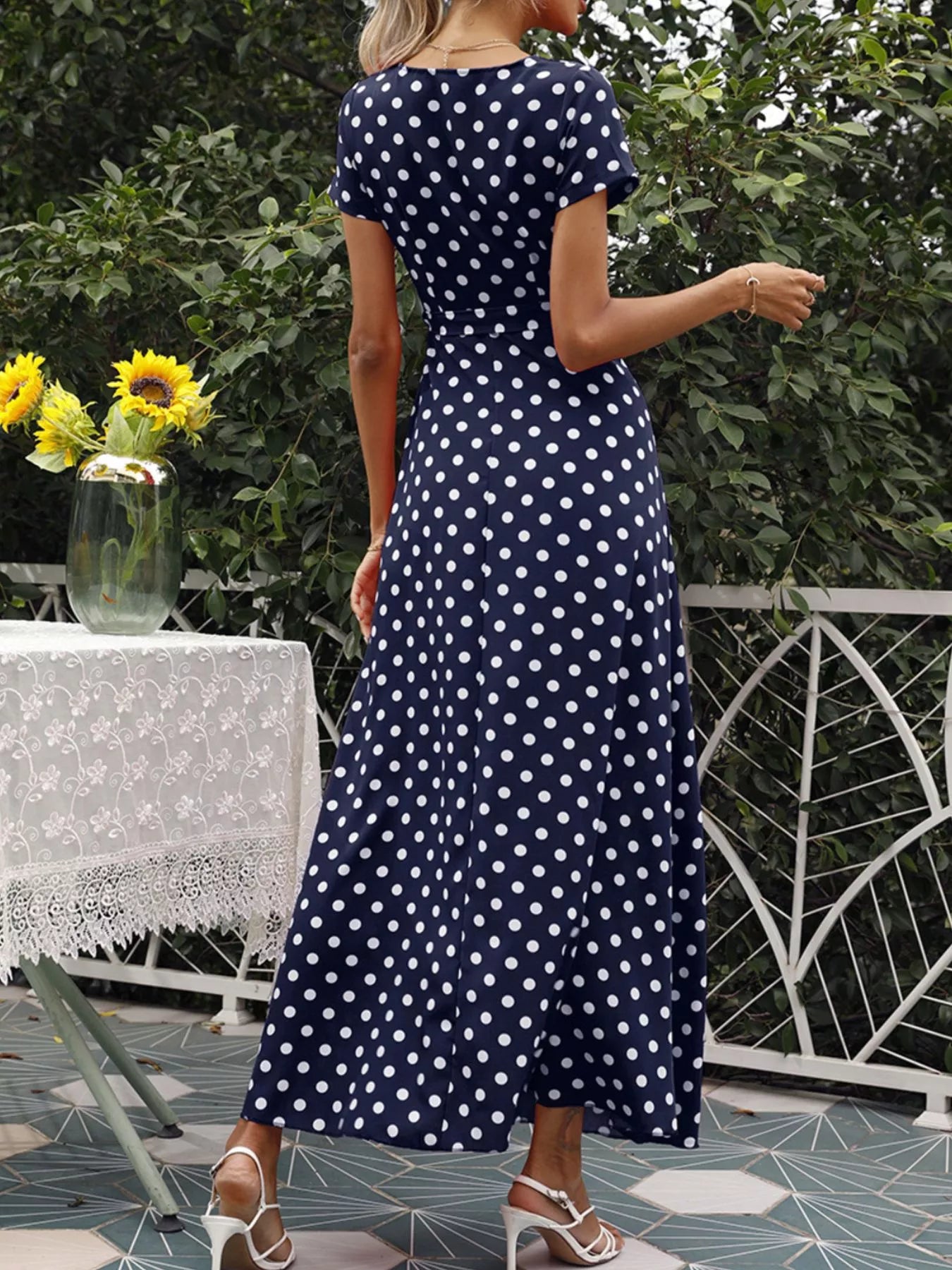 White polka dot wrap maxi dress with short sleeves, V-neck, waist tie and side slit
