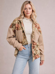 Model wears a relaxed floral waffle knit patchwork jacket with beige sleeves, button front, chest pockets, and an oversized silhouette.
