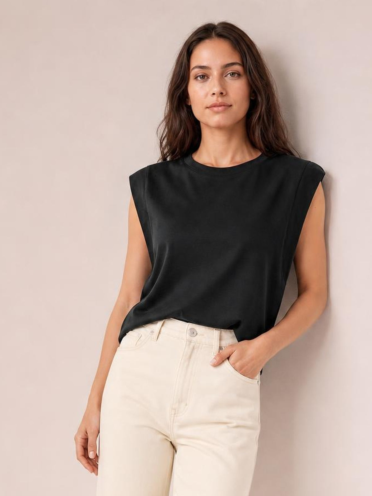 Model wears a black Florira round neck cap sleeve T-shirt with a relaxed straight silhouette, soft drape, and slightly stretchy construction.