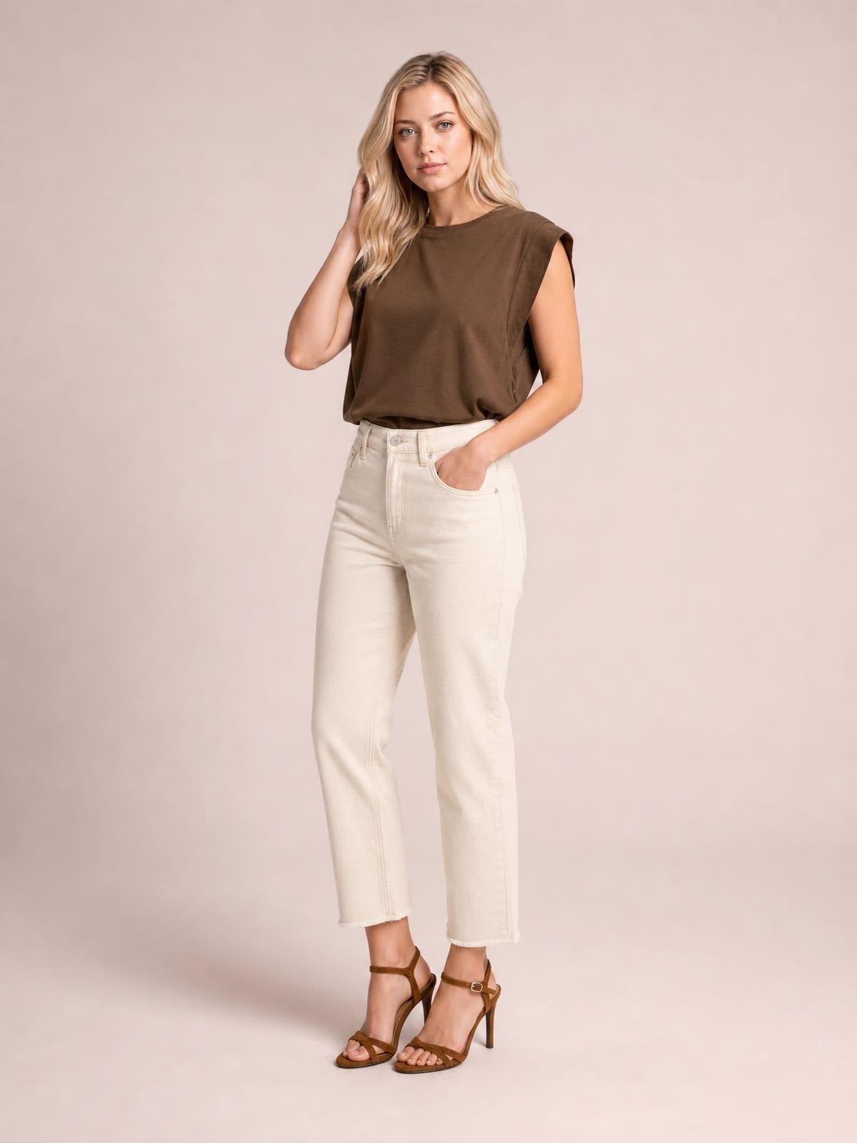 A model poses in the brown Florira round neck cap sleeve T-shirt, featuring a relaxed straight silhouette and slightly stretchy opaque construction.