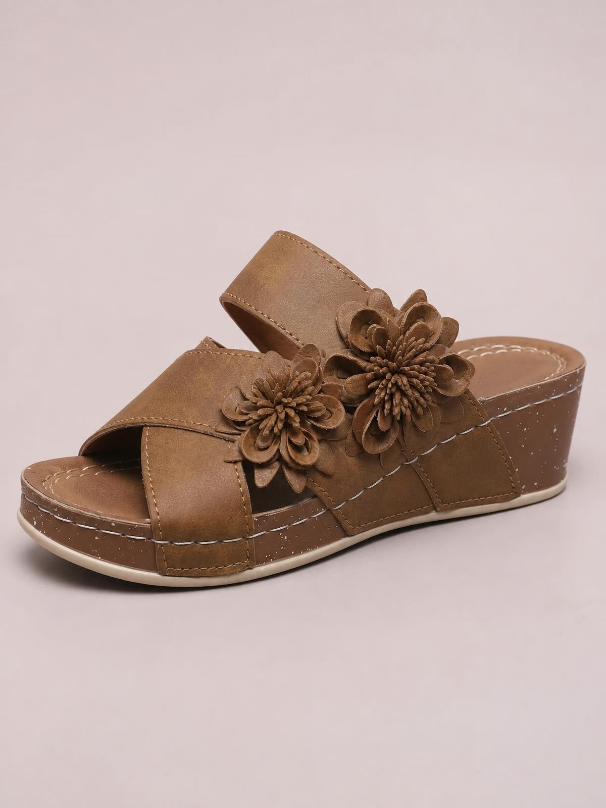 Brown flower crisscross wedge sandals feature open toes, layered floral accents, stitched PU leather straps, and a mid-height wedge sole.
