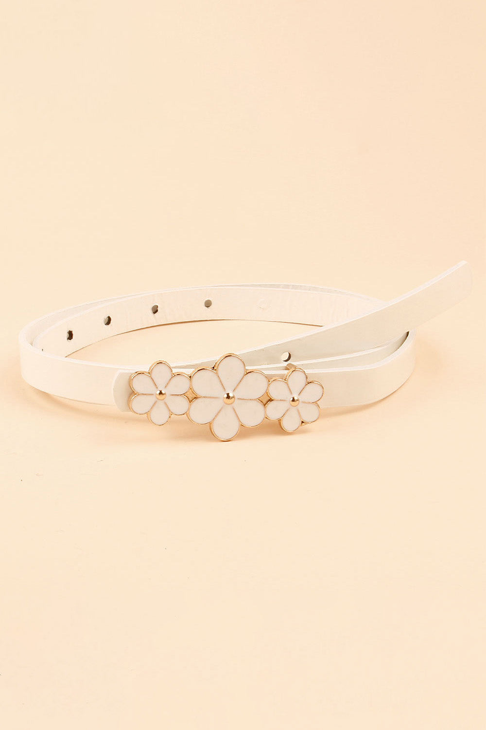 Slim ivory PU belt with a polished floral buckle featuring three outlined flowers and a row of adjustable holes.