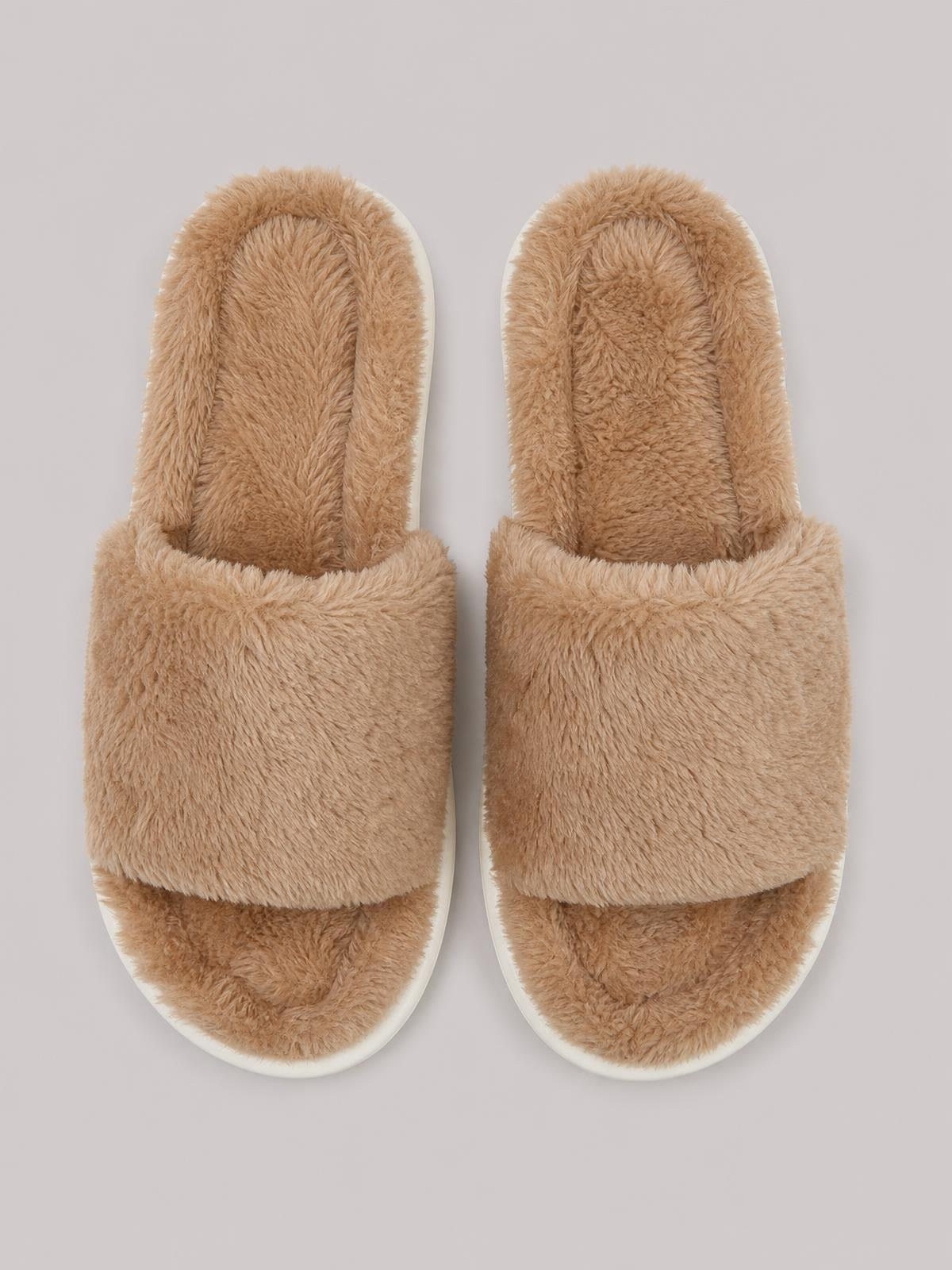 Tan fluffy open-toe comfort slippers with plush insoles, wide single-band uppers, rounded fronts, and flat white soles.