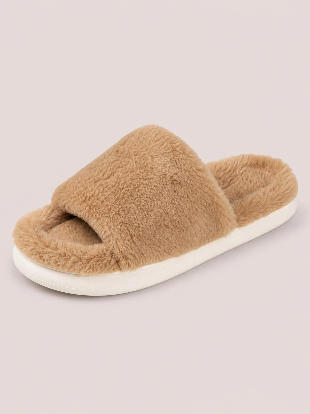 A tan fluffy open-toe comfort slipper features a broad fuzzy upper and a flat white rubber sole.