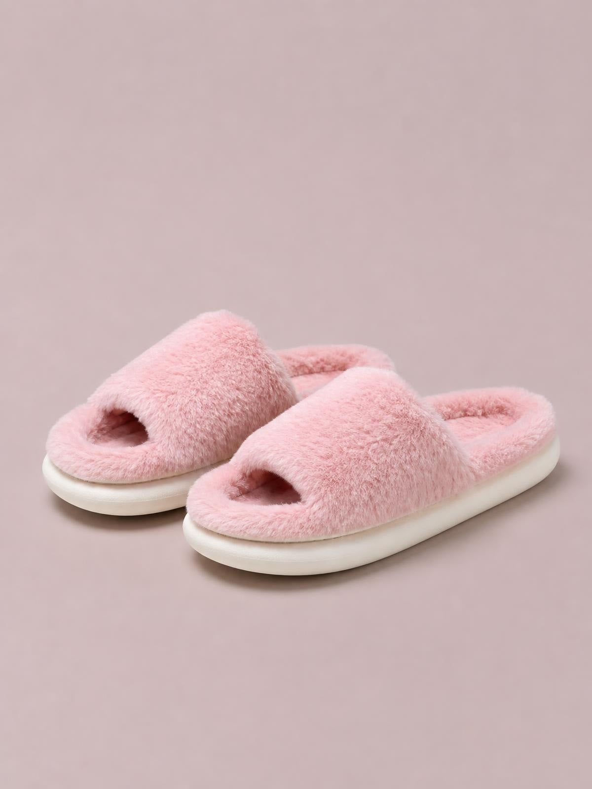 Pink fluffy open-toe comfort slippers with plush slide straps, soft lining, and thick flat rubber soles.