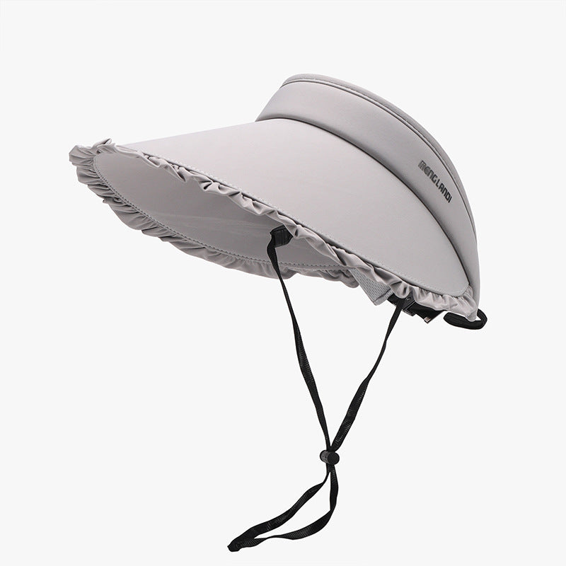 Light gray frill adjustable sun hat with a softly rounded visor silhouette, wide ruffled brim, smooth construction, and a visible black chin strap.