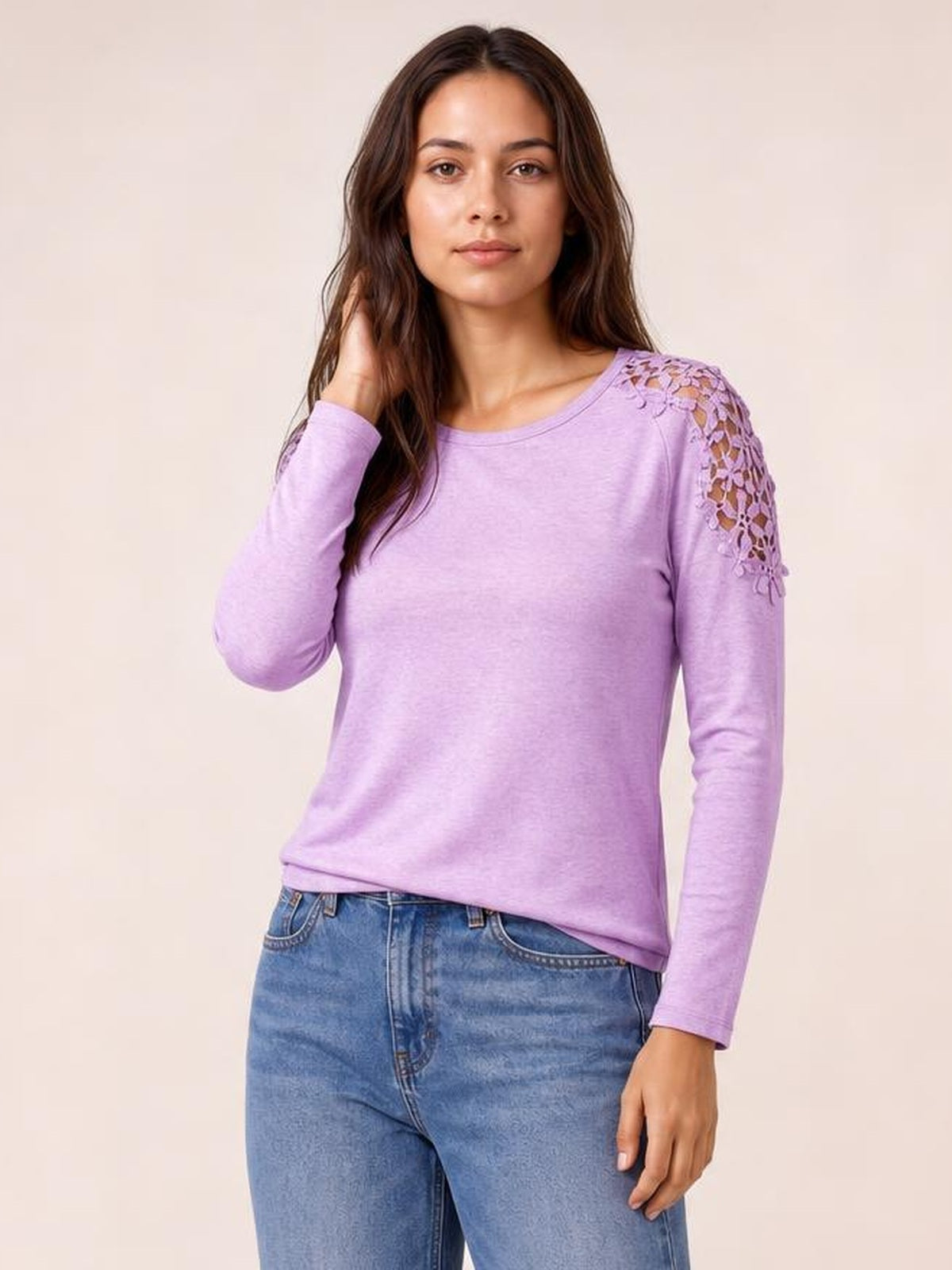 A model poses in a lavender cutout round neck long sleeve T-shirt with floral lace shoulder panels and a relaxed, straight silhouette.