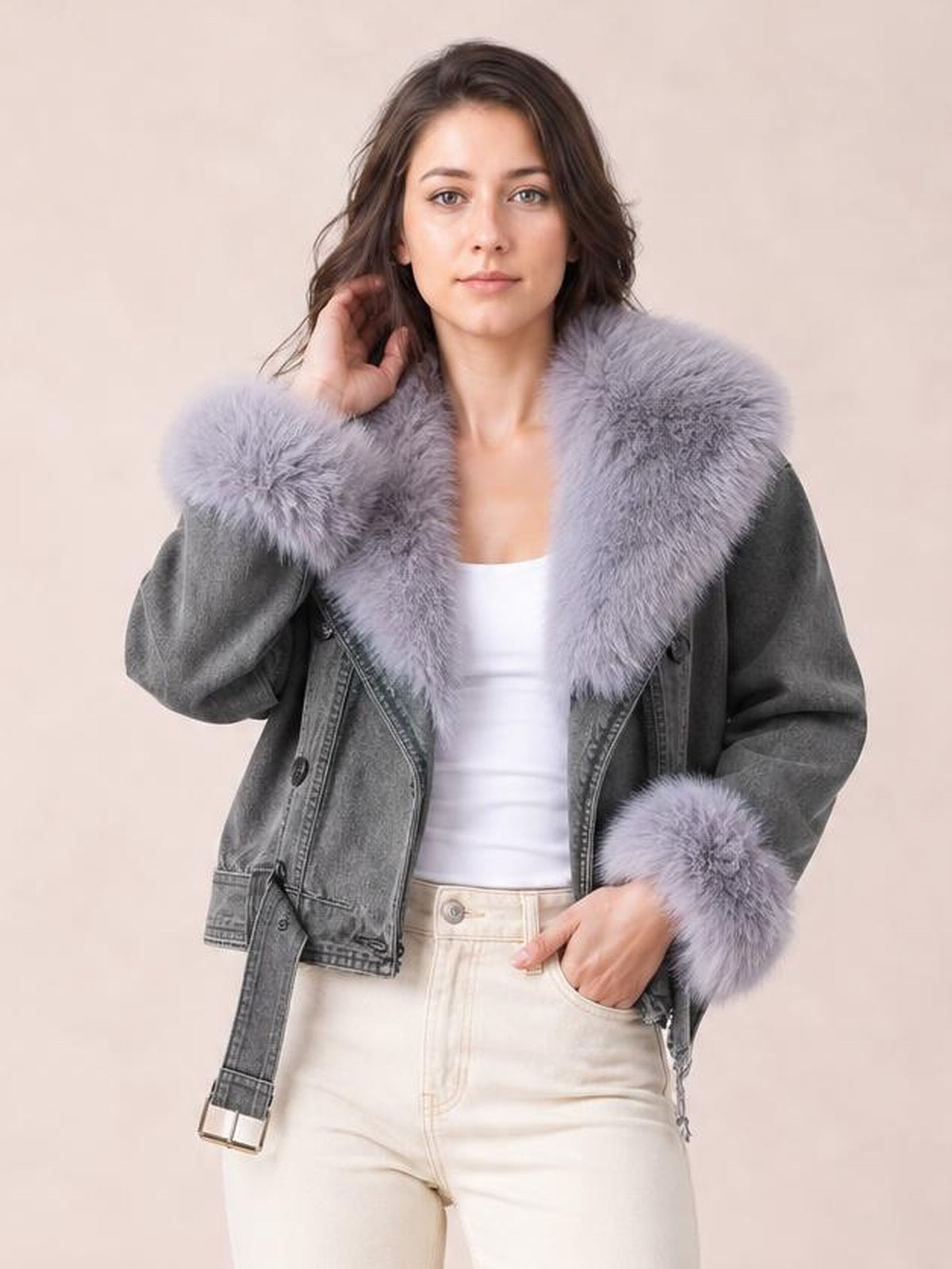 A model poses in a gray denim jacket with a plush lavender faux fur collar and cuffs, zip front, belted hem, and relaxed silhouette.