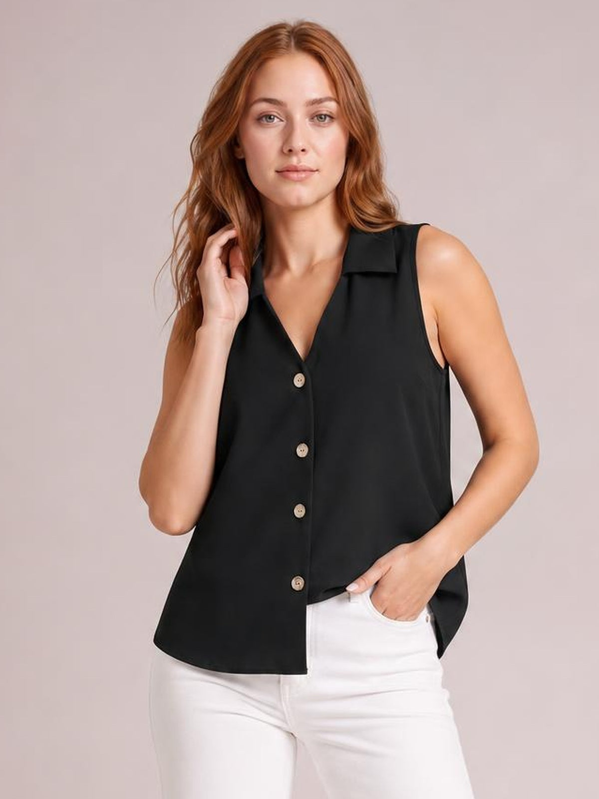 Model poses in a black Johnny collar button-up tank with a V-neck, sleeveless cut, front buttons, and relaxed straight silhouette.