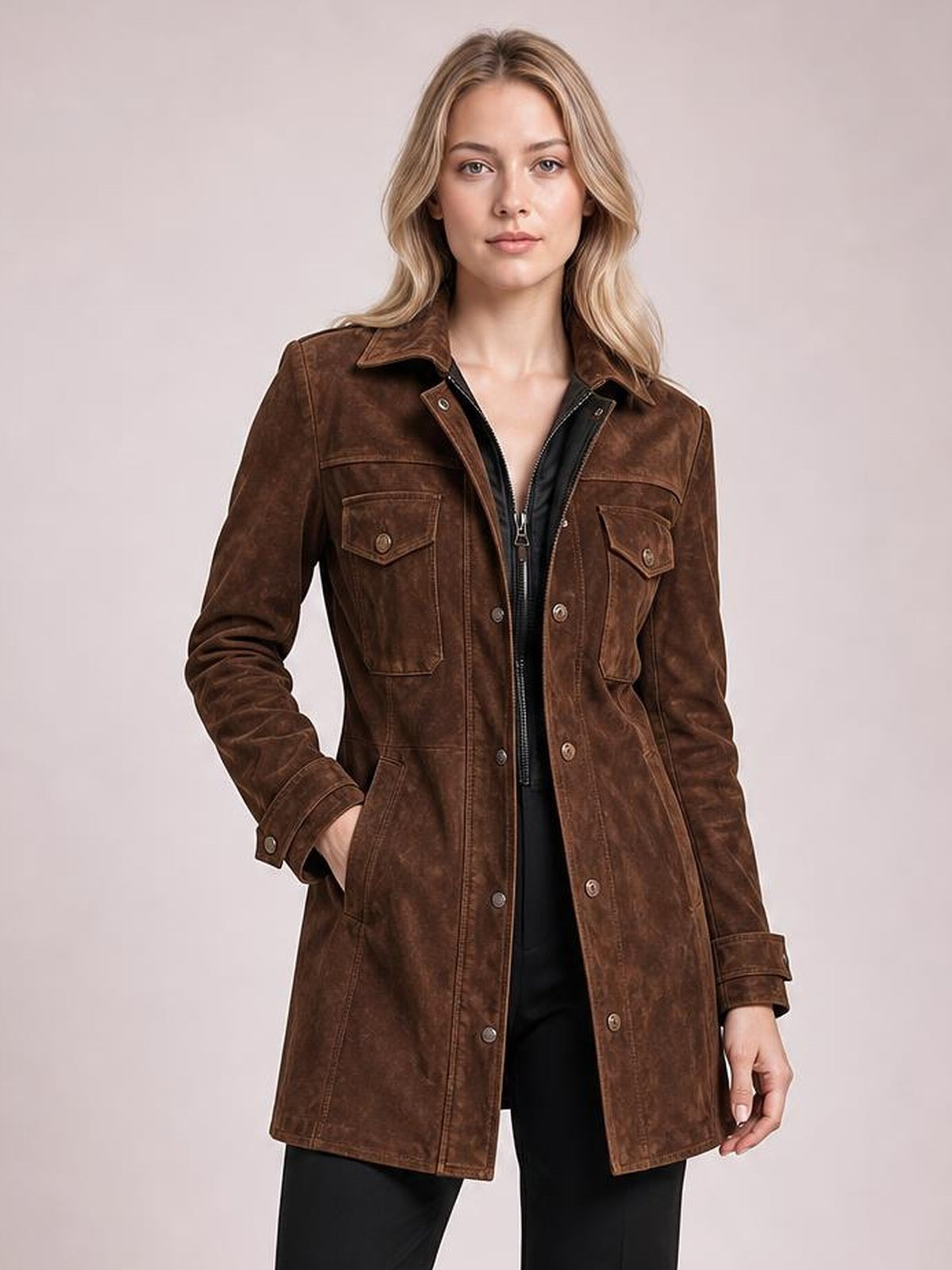 A model poses in a brown long-sleeve jacket with a collared neckline, button-and-zip front, tailored seams, and multiple flap pockets.