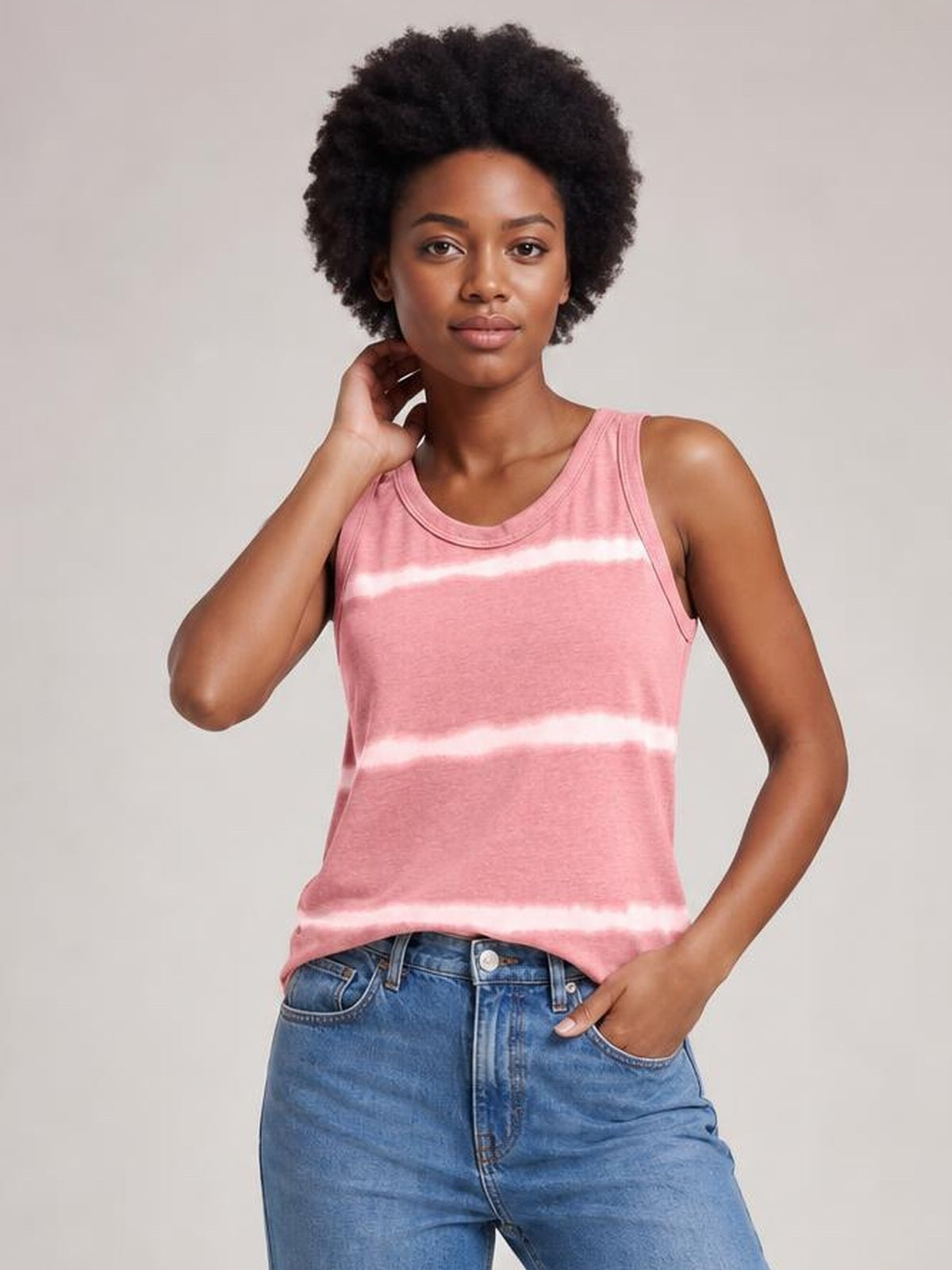 Model poses in a pink tie-dye round neck tank with wide shoulder straps, a relaxed straight silhouette, and horizontal white bands.