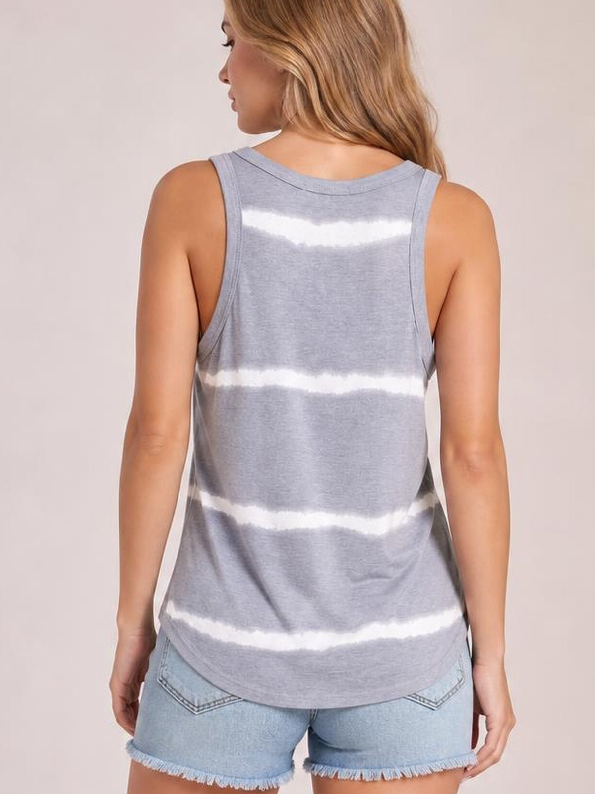 Model shown from the back wears a gray tie-dye round neck tank with wide straps, a relaxed silhouette, curved hem, and horizontal white bands.