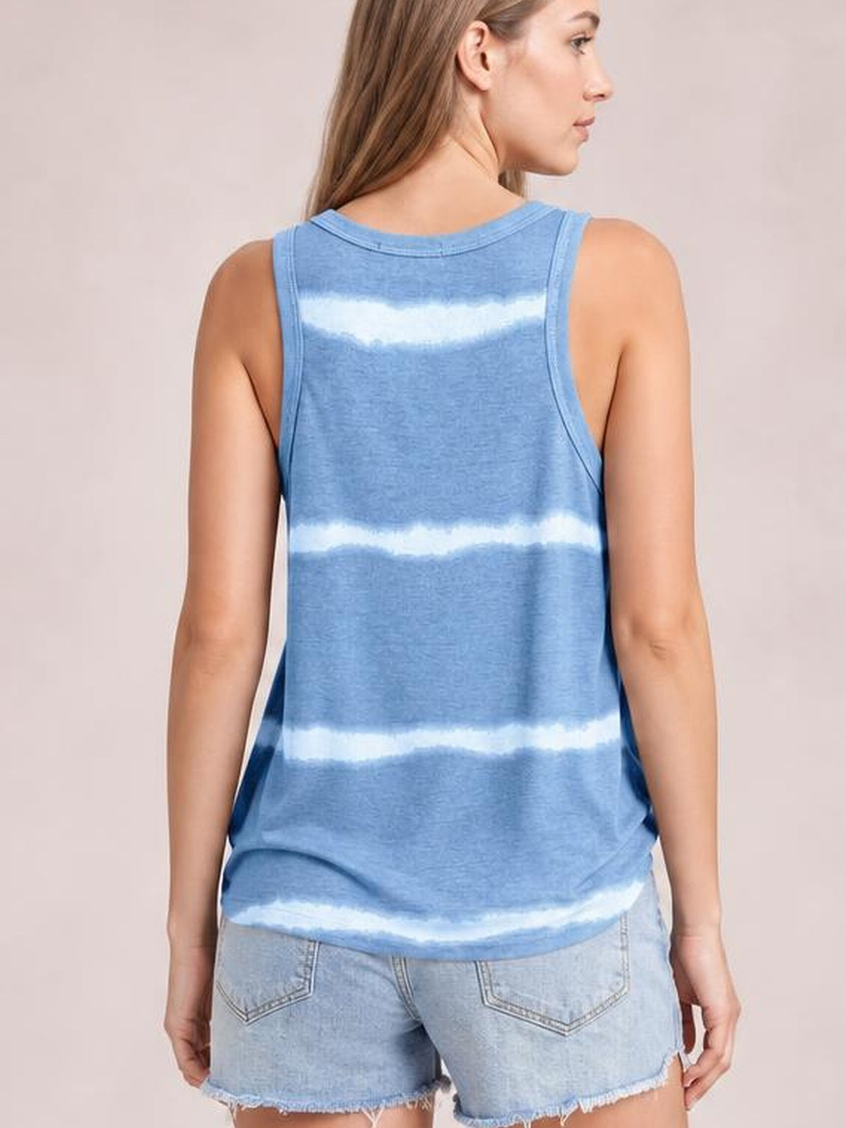 Model shown from behind wears a blue tie-dye round neck tank with wide straps, relaxed silhouette, subtle stretch, and a curved hem.