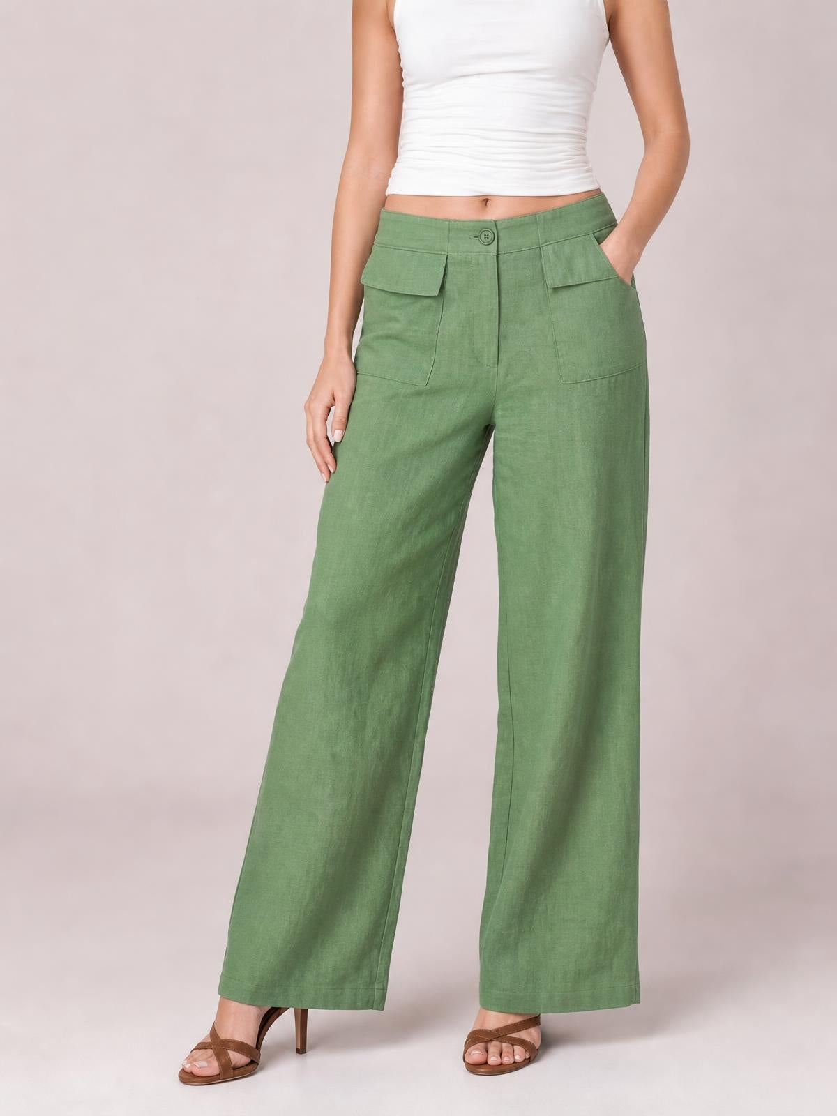 Model wearing sage green wide leg pants with a button closure, belt loops, front patch pockets, side pockets, and a relaxed full-length silhouette.
