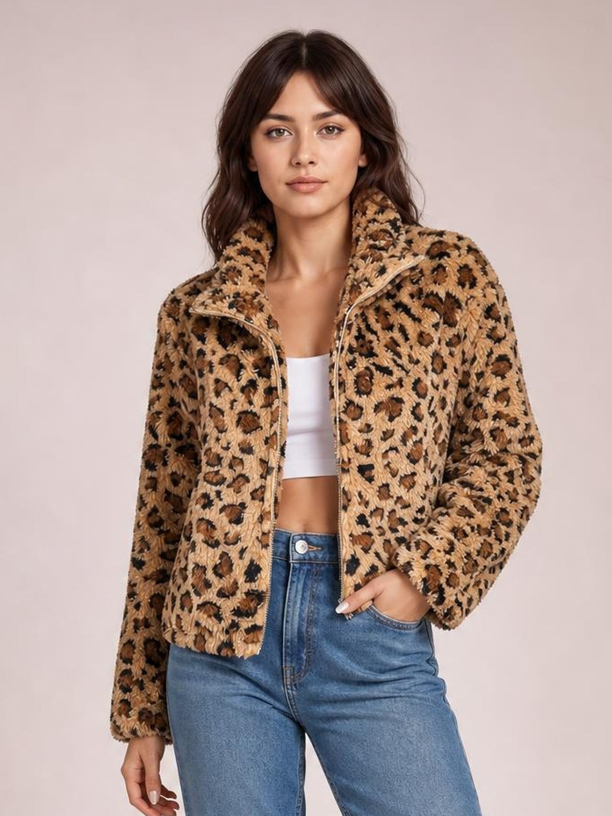 Model poses in a fuzzy tan leopard-print zip-up jacket with a high turtleneck collar, long sleeves, and a relaxed cropped silhouette.