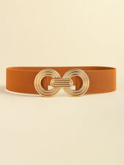 Rust-brown elastic wide belt featuring a polished gold alloy geometric buckle with interlocking rounded forms and a sleek, broad silhouette.