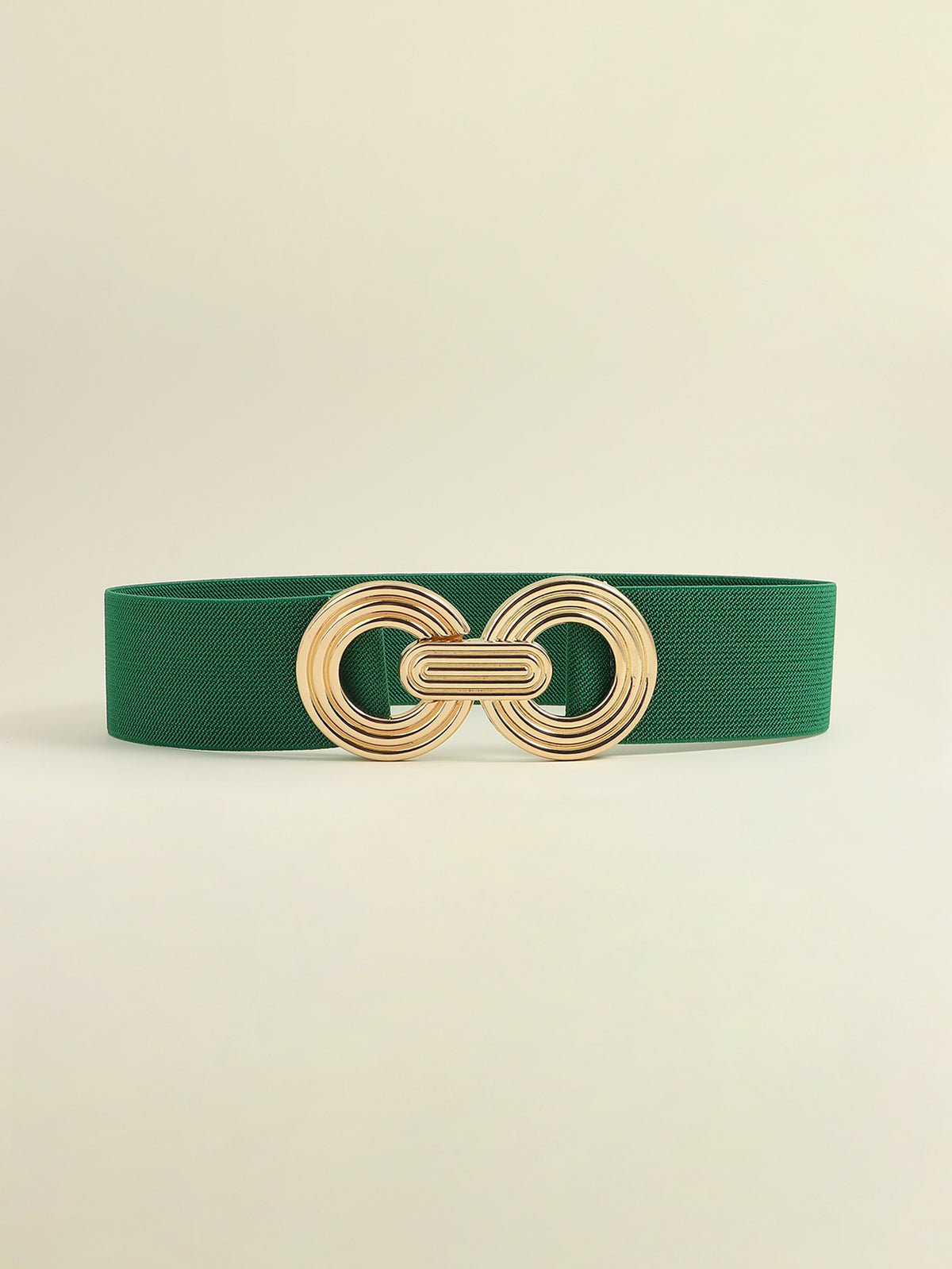 Green elastic wide belt with a polished gold-tone geometric buckle featuring interlocking rounded forms and a layered, dimensional design.