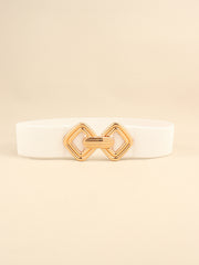 White elastic wide belt with a polished gold-tone alloy buckle featuring interlocking geometric shapes and a structured statement silhouette.