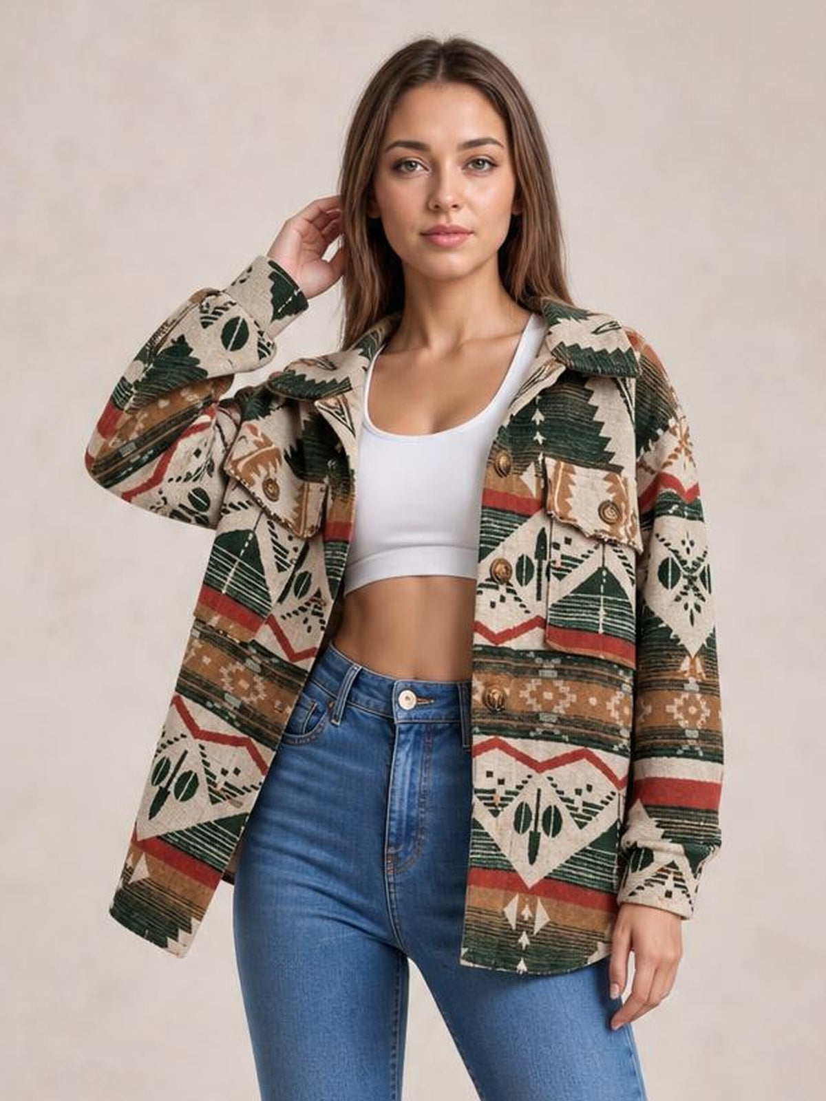 A model poses in a beige geometric button-up jacket with long sleeves, a relaxed silhouette, collared construction, and two front flap pockets.