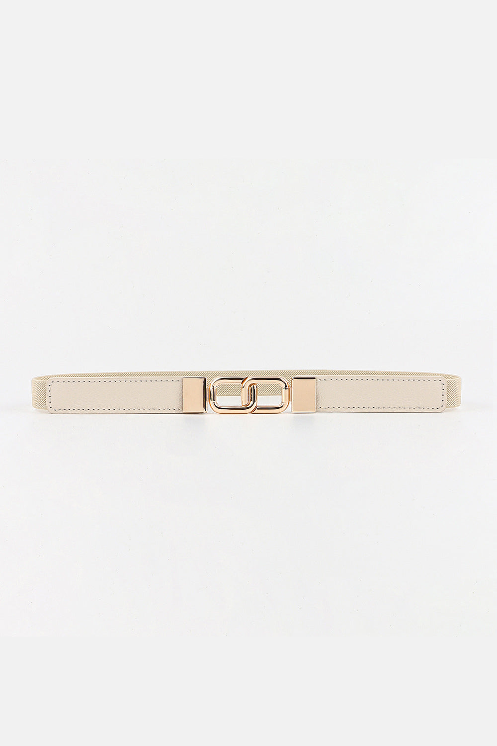 Slim cream elastic belt with stitched PU panels, textured edges, and a geometric gold-tone double buckle creating a sleek, structured silhouette.
