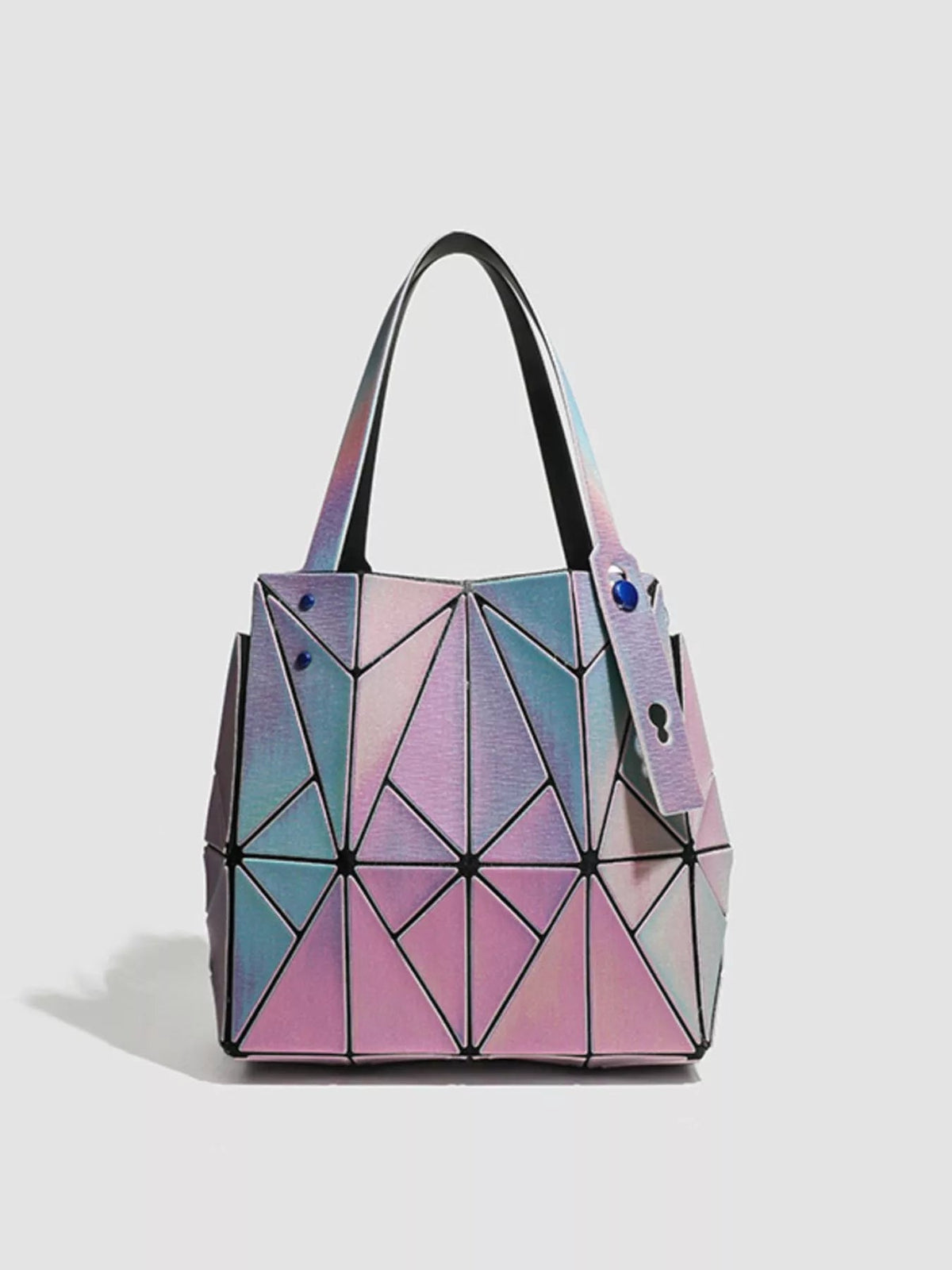 Medium geometric iridescent PVC shoulder bag with faceted pink, blue, and silver panels, structured silhouette, and twin top handles.