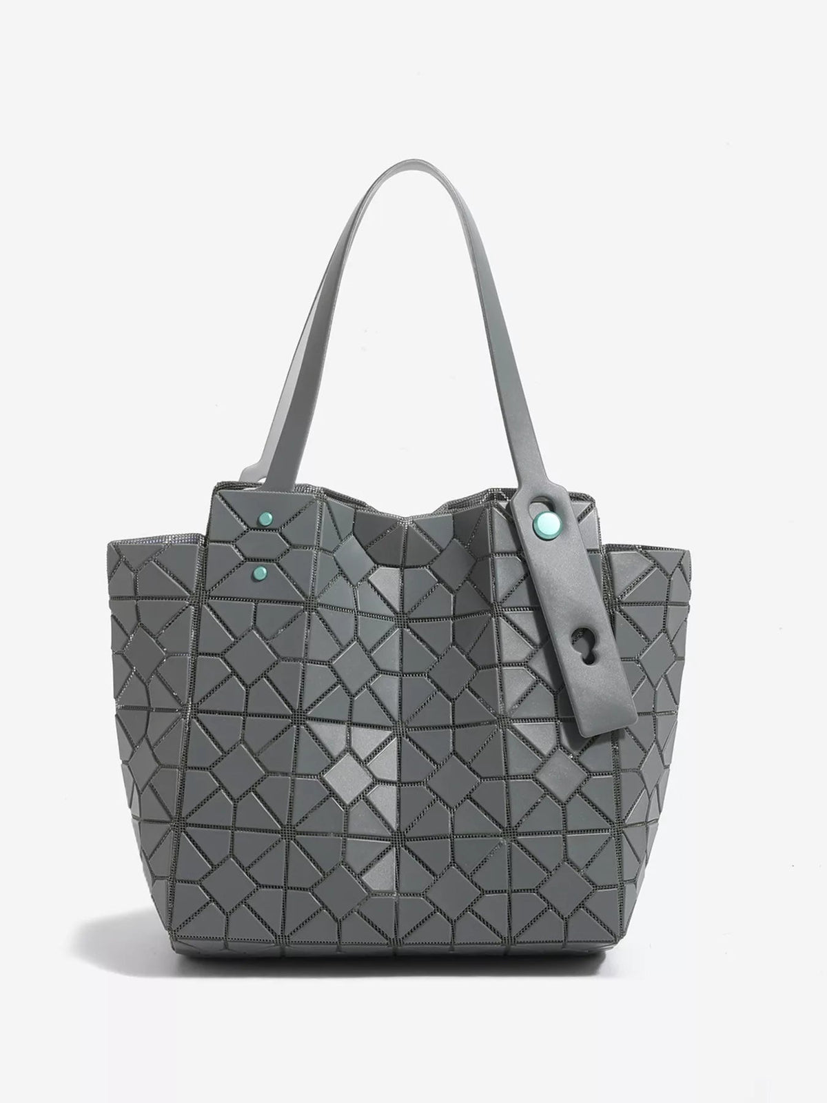 A medium gray PVC structured handbag features a geometric lattice pattern, twin top handles, and a front fastening strap with turquoise accents.