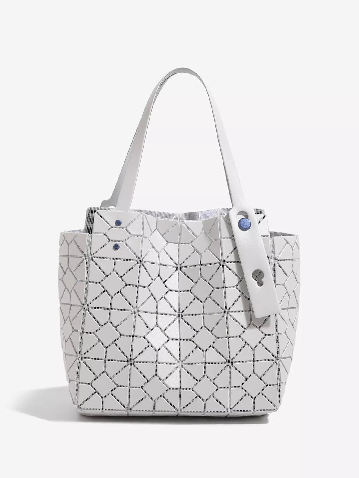 Medium white structured PVC handbag featuring a geometric lattice pattern, spacious tote silhouette, dual handles, and a front fastening strap.