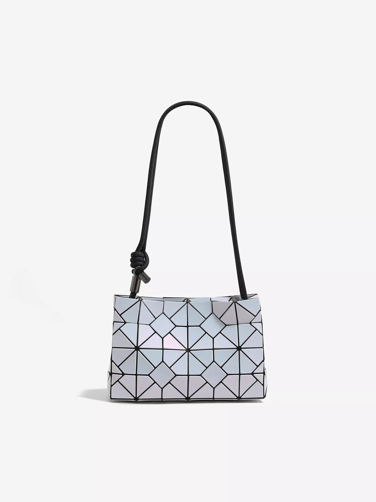 Small geometric prism iridescent shoulder bag in reflective PVC with a structured rectangular silhouette, faceted panel construction, and a long black strap.