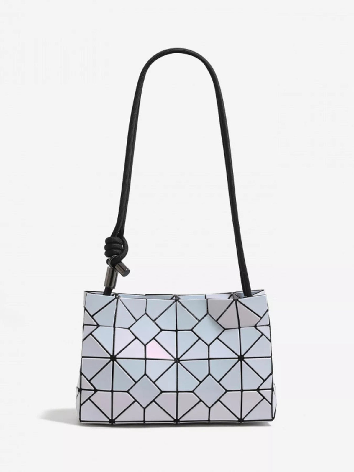 Small geometric prism shoulder bag in iridescent PVC with a structured rectangular silhouette, black shoulder strap, and distinctive knotted attachment.