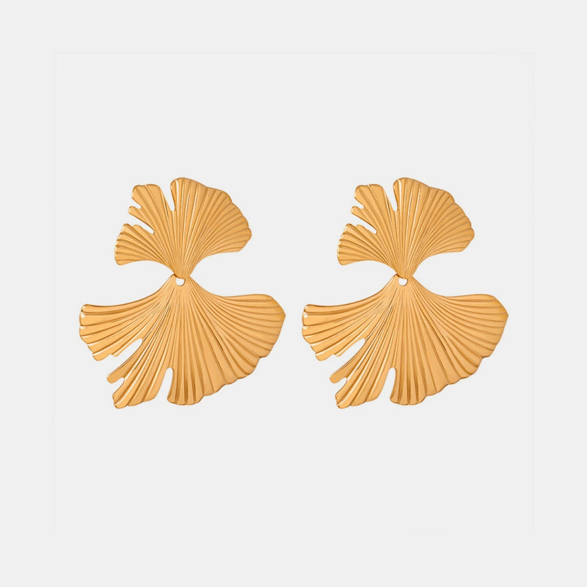 Gold-tone Ginkgo Biloba design stud earrings feature elongated fan-shaped leaf silhouettes with detailed ribbed construction and a polished finish.