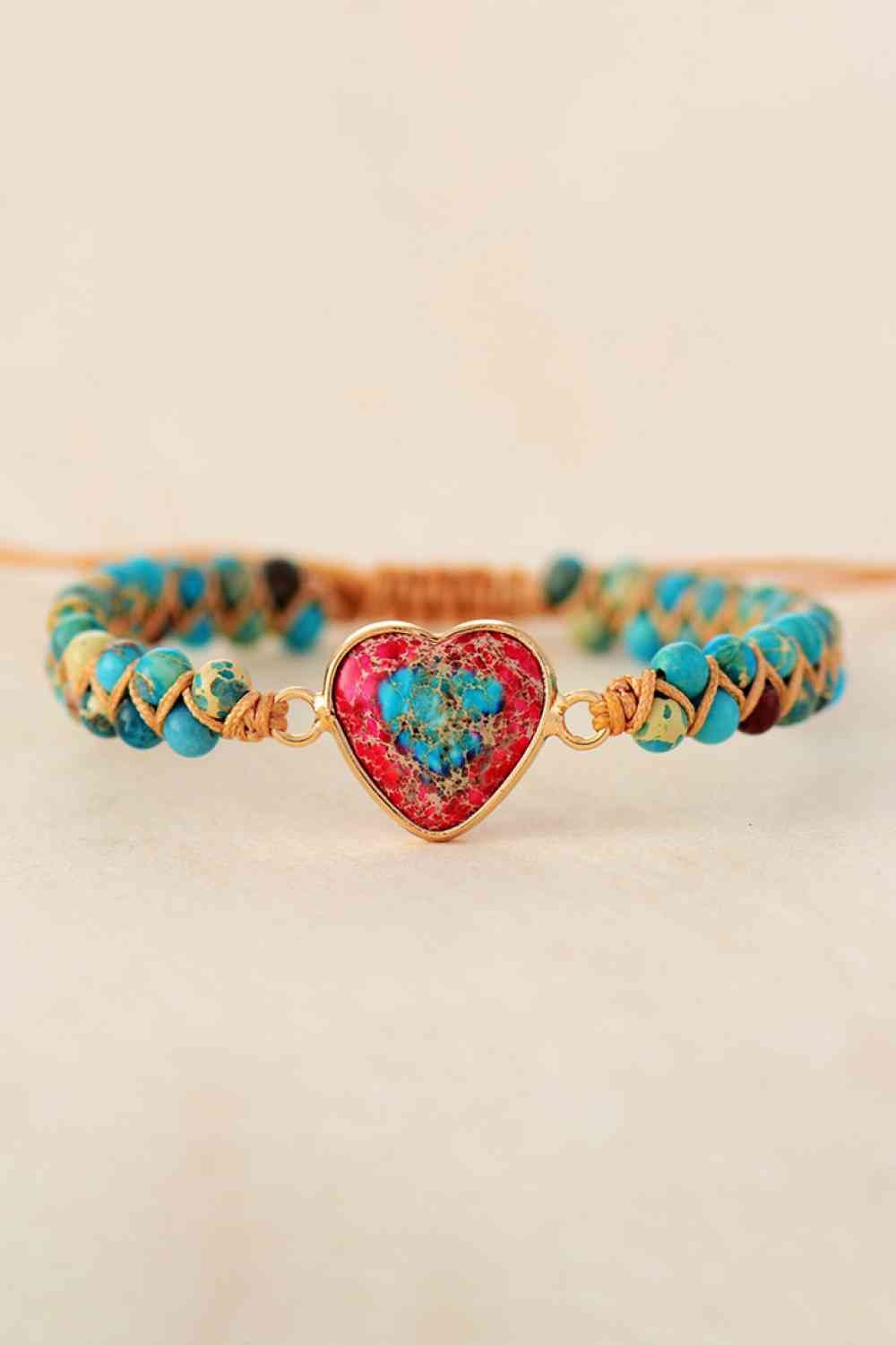 Handmade heart shape natural stone bracelet with turquoise and multicolor beads, woven cord accents, and a gold-tone copper heart centerpiece.
