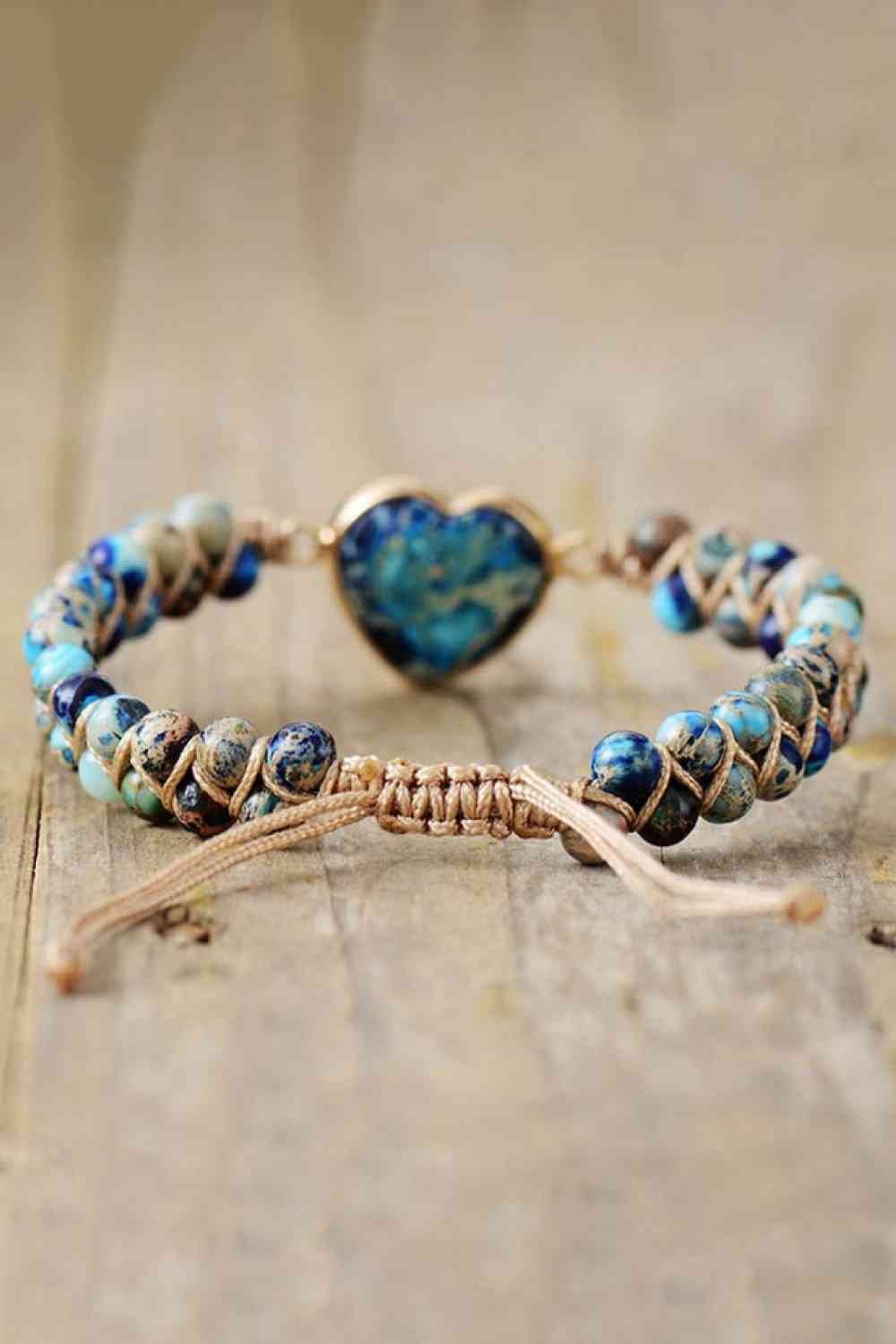 Handmade modern bracelet featuring blue and turquoise natural stone beads, a heart-shaped center stone, copper accents, and an adjustable woven cord closure.