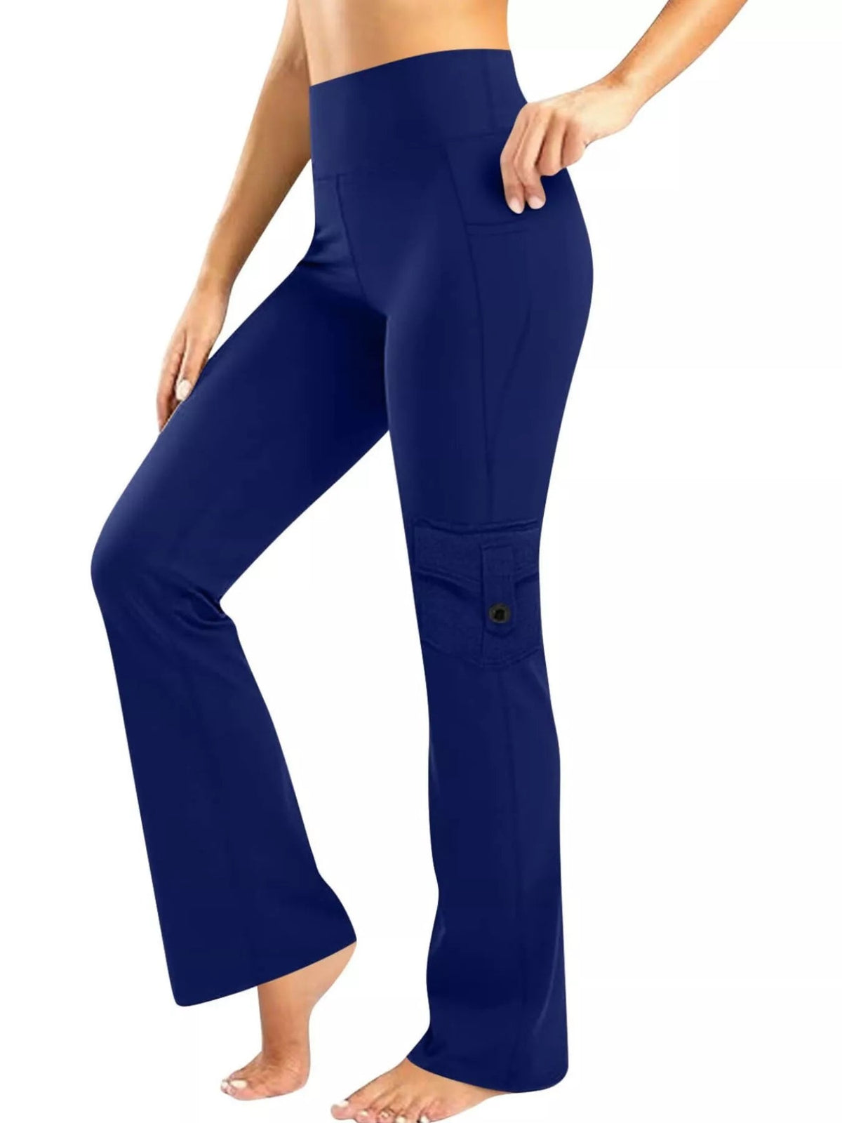 Model poses in navy high-waisted yoga pants with a relaxed straight-leg silhouette, side pockets, and a patch pocket detail on the lower leg.