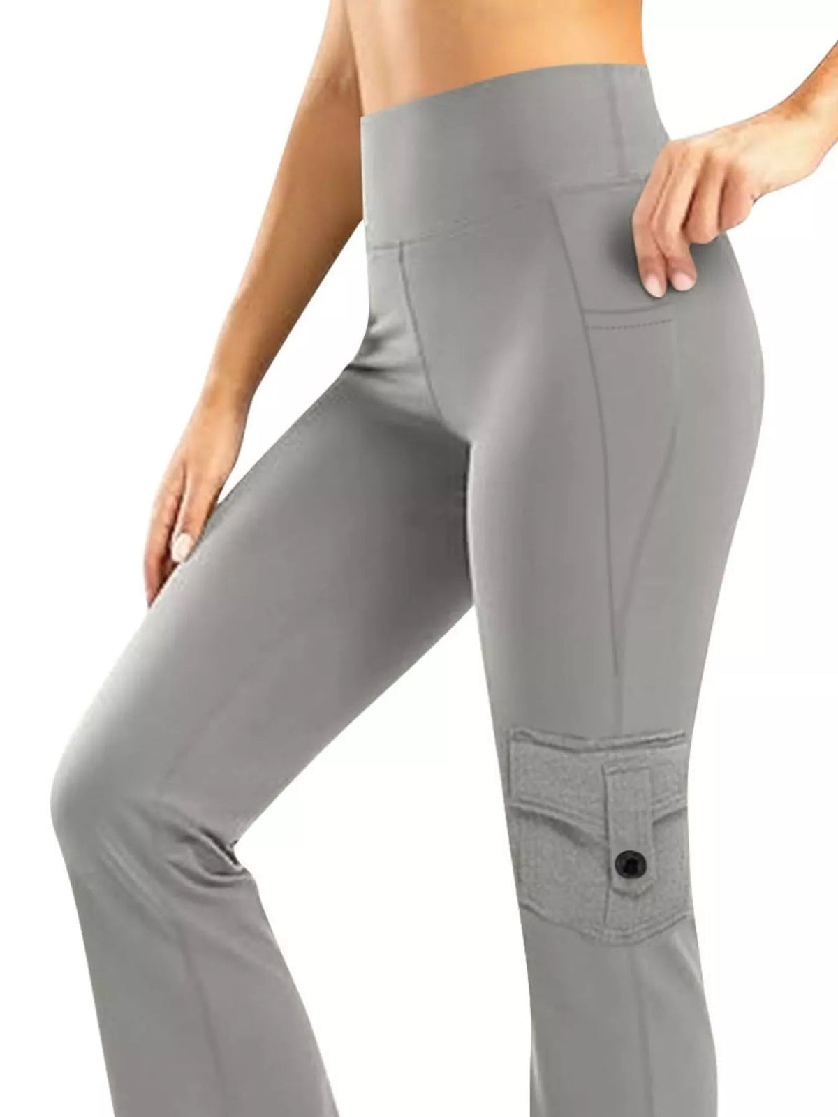 Model wearing gray high-waisted yoga pants with a straight-leg silhouette, side pockets, and a buttoned cargo-style thigh pocket, posing with one leg raised.