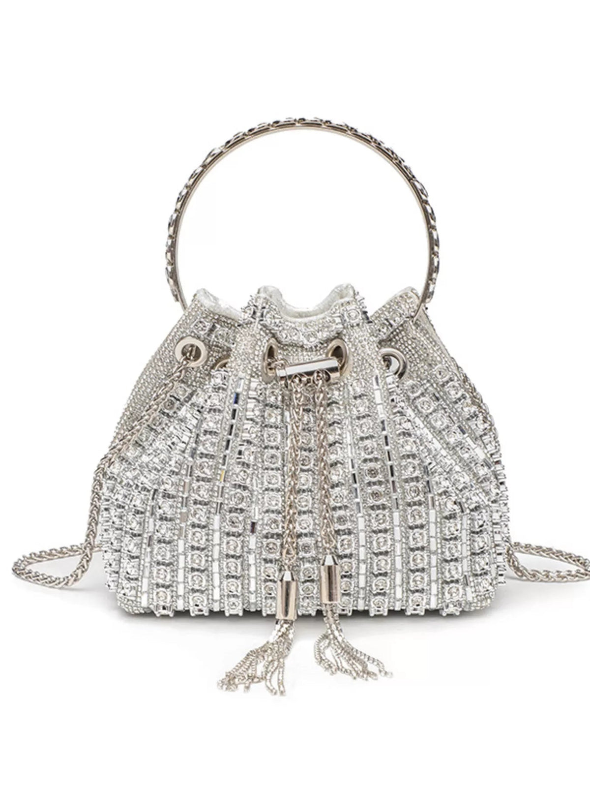 Mini silver rhinestone-embellished bucket handbag with a flared silhouette, ring handle, drawstring closure, tassel ends, and chain crossbody strap.